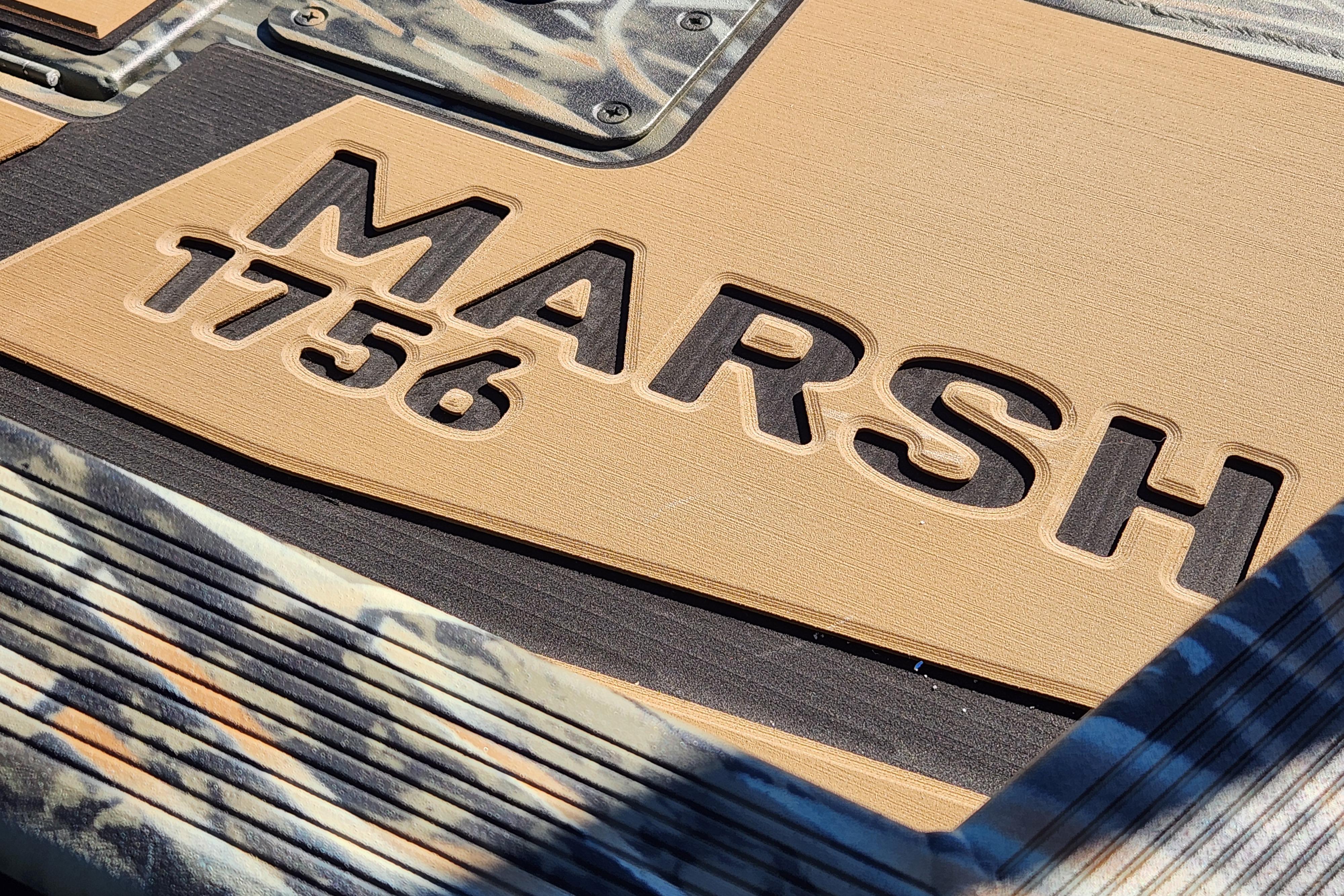 Tracker Grizzly 1756 T Marsh 2026 model, embossed lettering on textured surface.