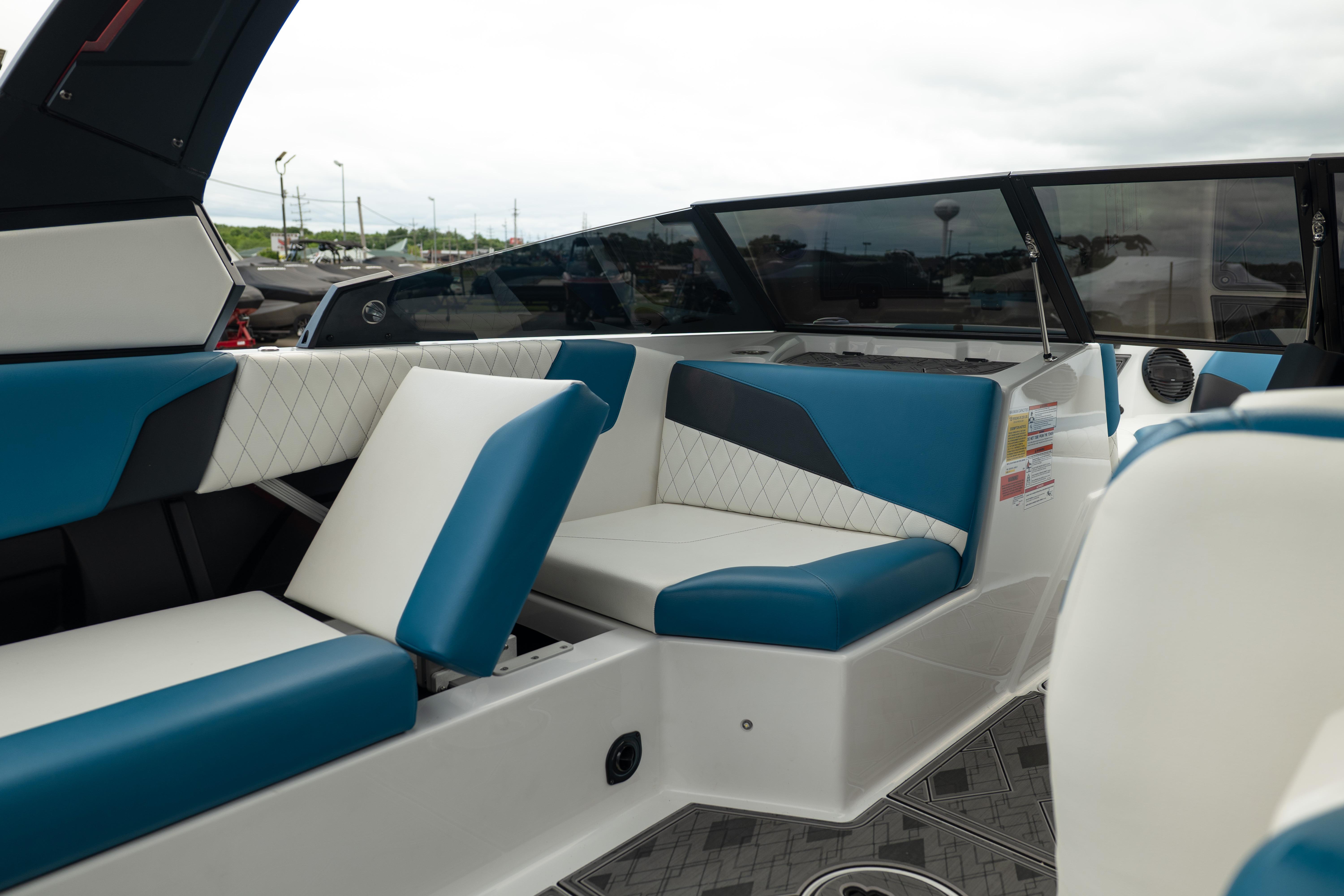 2024 Tigé Z5 boat interior with blue and white seating, showcasing modern design.