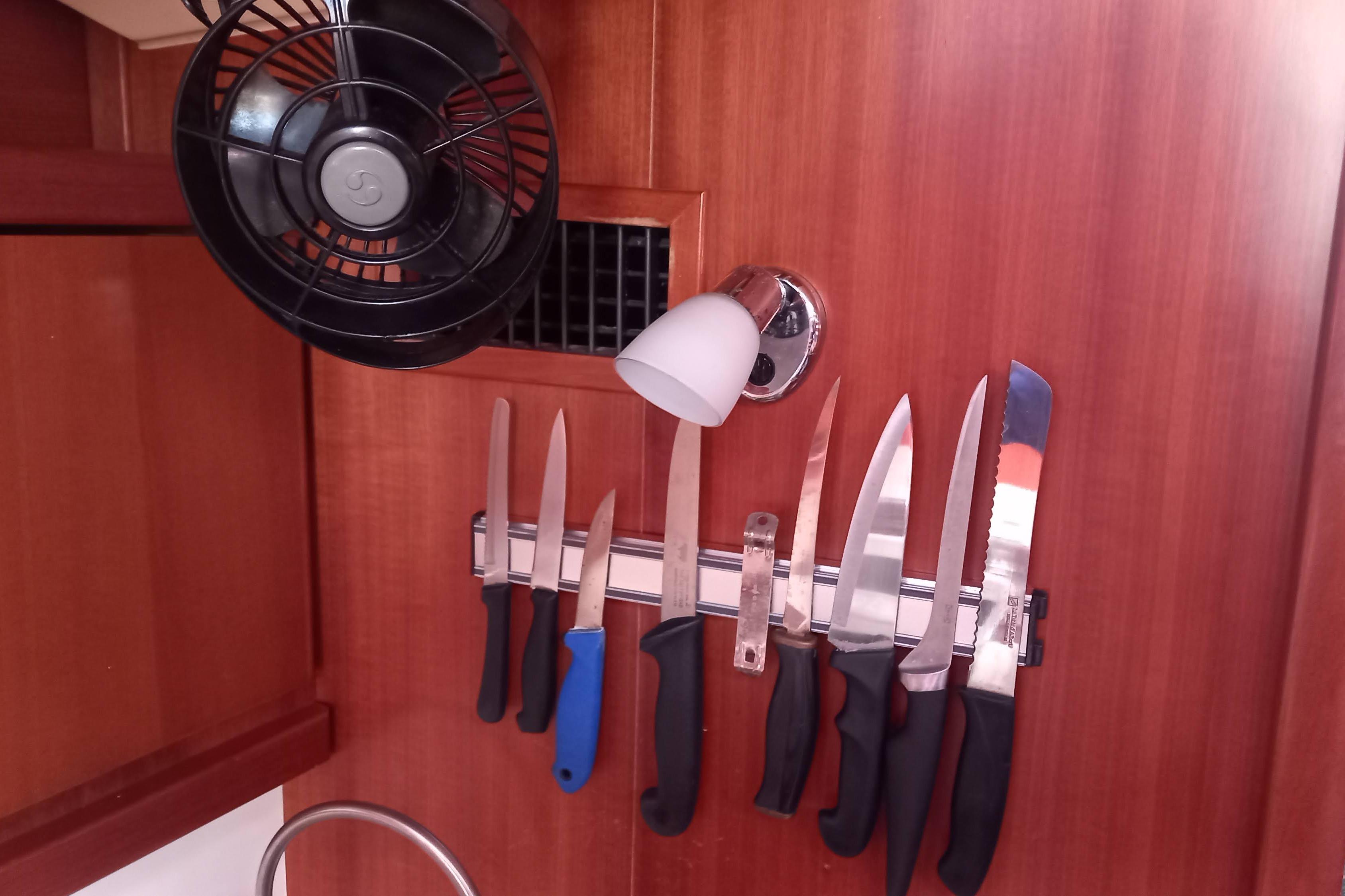 Magnetic knife rack and fan in 2011 Dufour 425 Grand Large yacht kitchen.