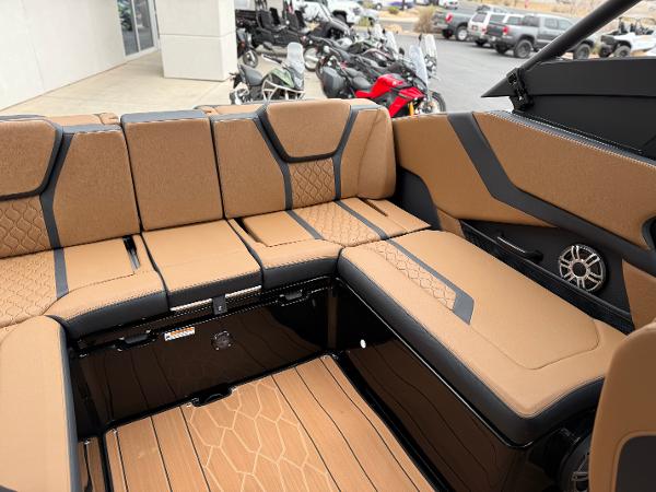2025 Yamaha Boats 255XD interior with tan and black seating, showcasing modern design and comfort.