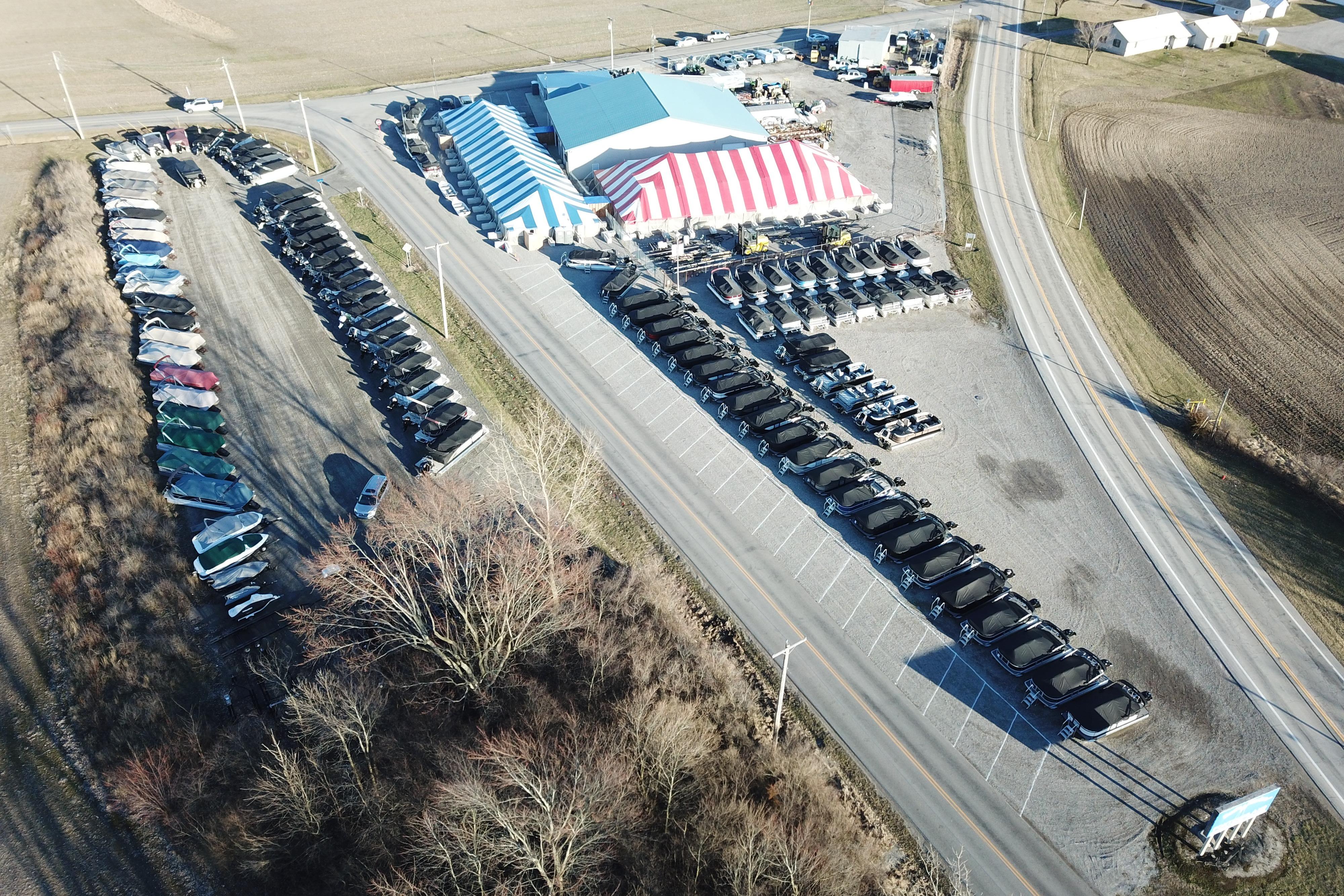 Aerial view of Barletta ARIA 20CC boats displayed at a dealership, 2026 model.