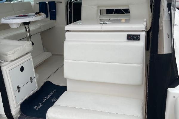 2003 Tiara Yachts 3500 Open interior with white seating and table.