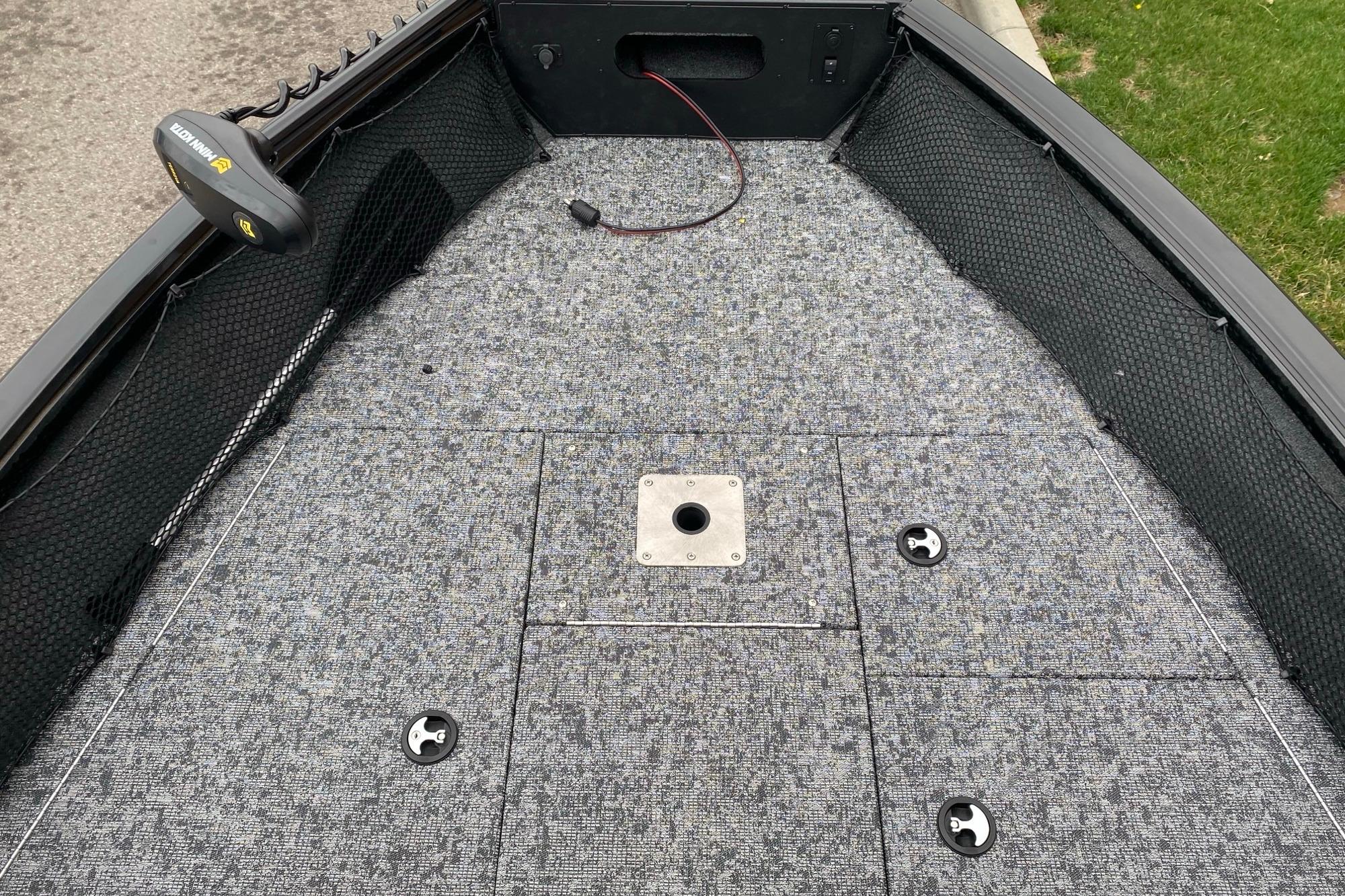 2026 Ranger VS1882SC Angler boat deck with gray carpet and storage compartments.