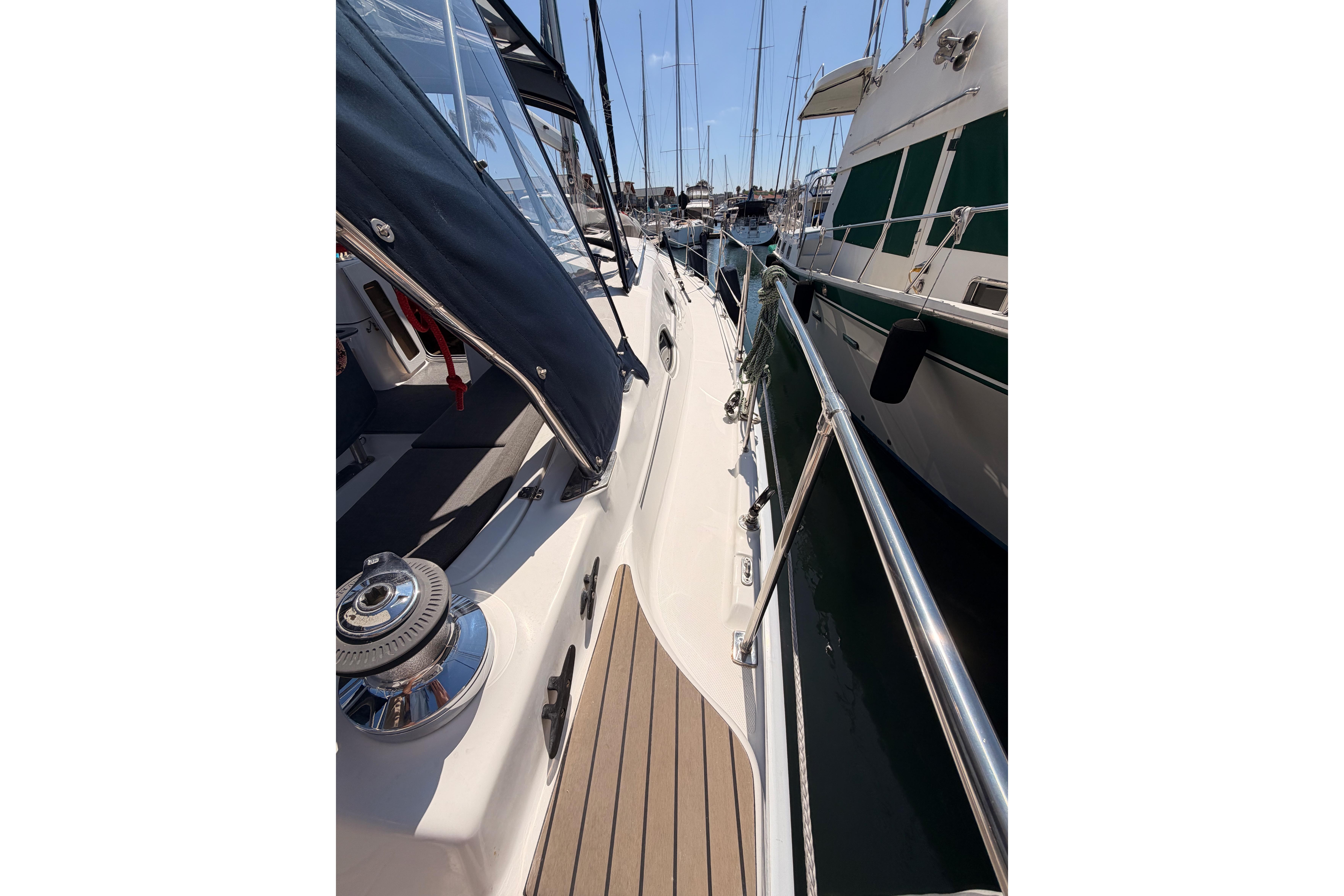 2008 Hunter 45 Deck Salon yacht docked, showcasing sleek deck design and marina setting.