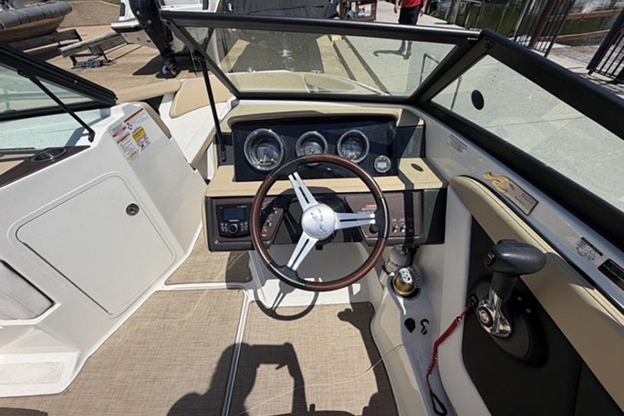 2018 Sea Ray SPX 190 boat interior with steering wheel and dashboard controls.