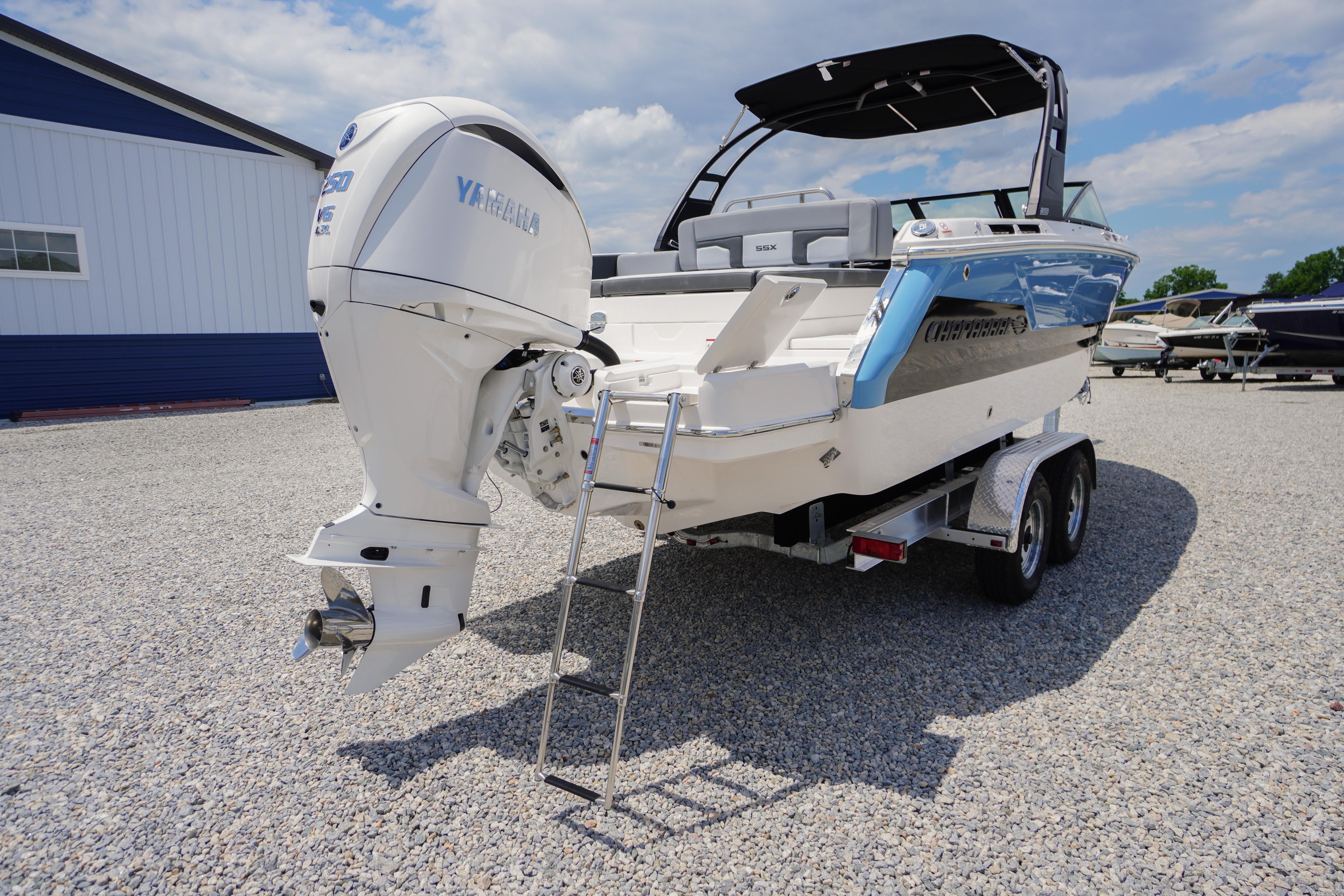 2026 Chaparral SSX 4 boat on trailer, featuring Yamaha outboard motor, parked on gravel.
