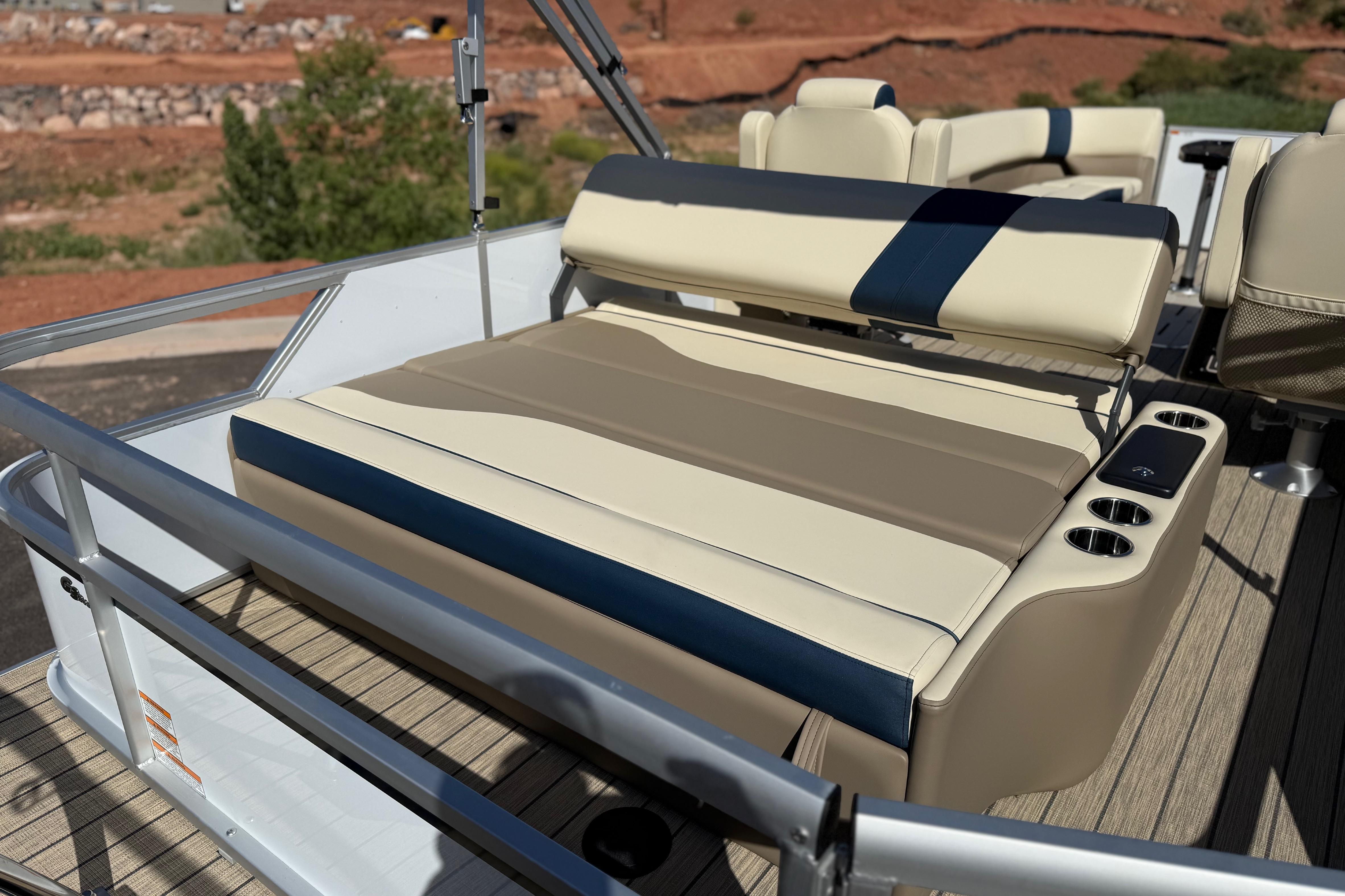 Luxury seating on 2026 SunCatcher Select 322SL pontoon boat with cup holders and sleek design.