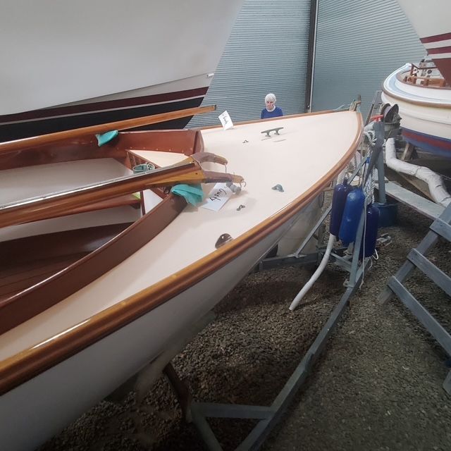 2003 Herreshoff 12.5 sailboat in storage facility.
