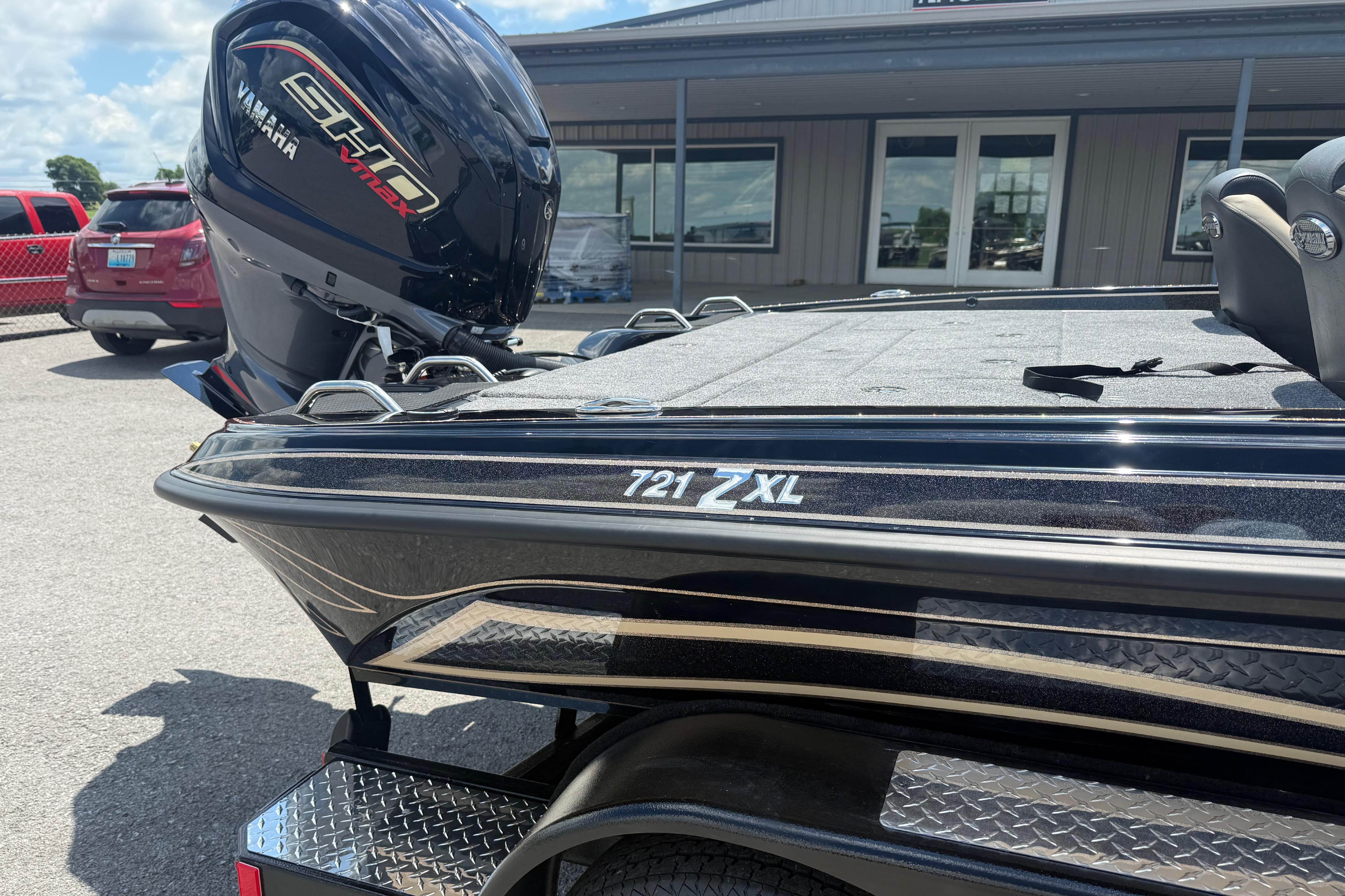2027 Phoenix 721 ZXL boat with Yamaha engine, parked outdoors.
