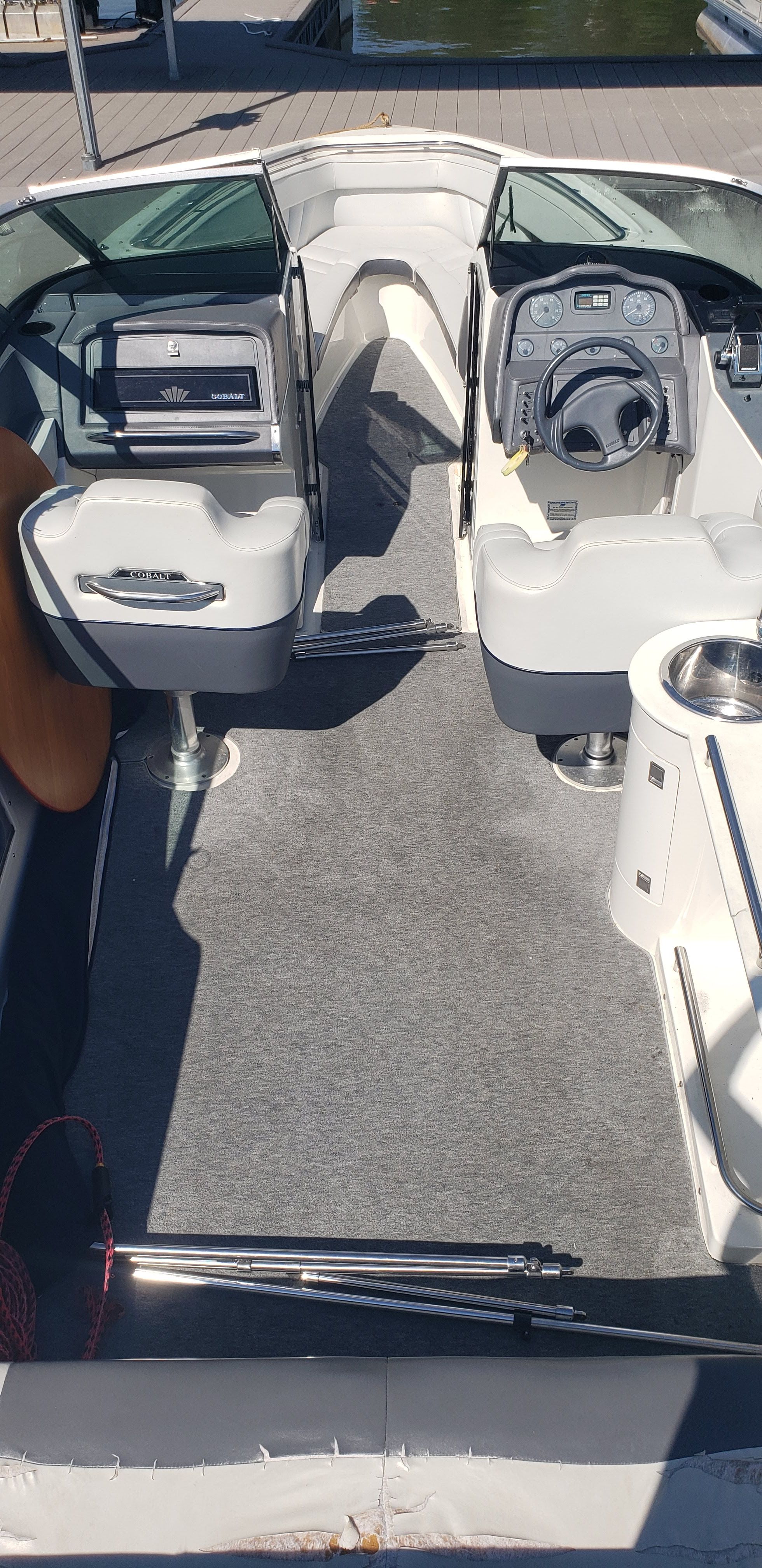 Interior of a 1993 Cobalt 272 boat with steering console.