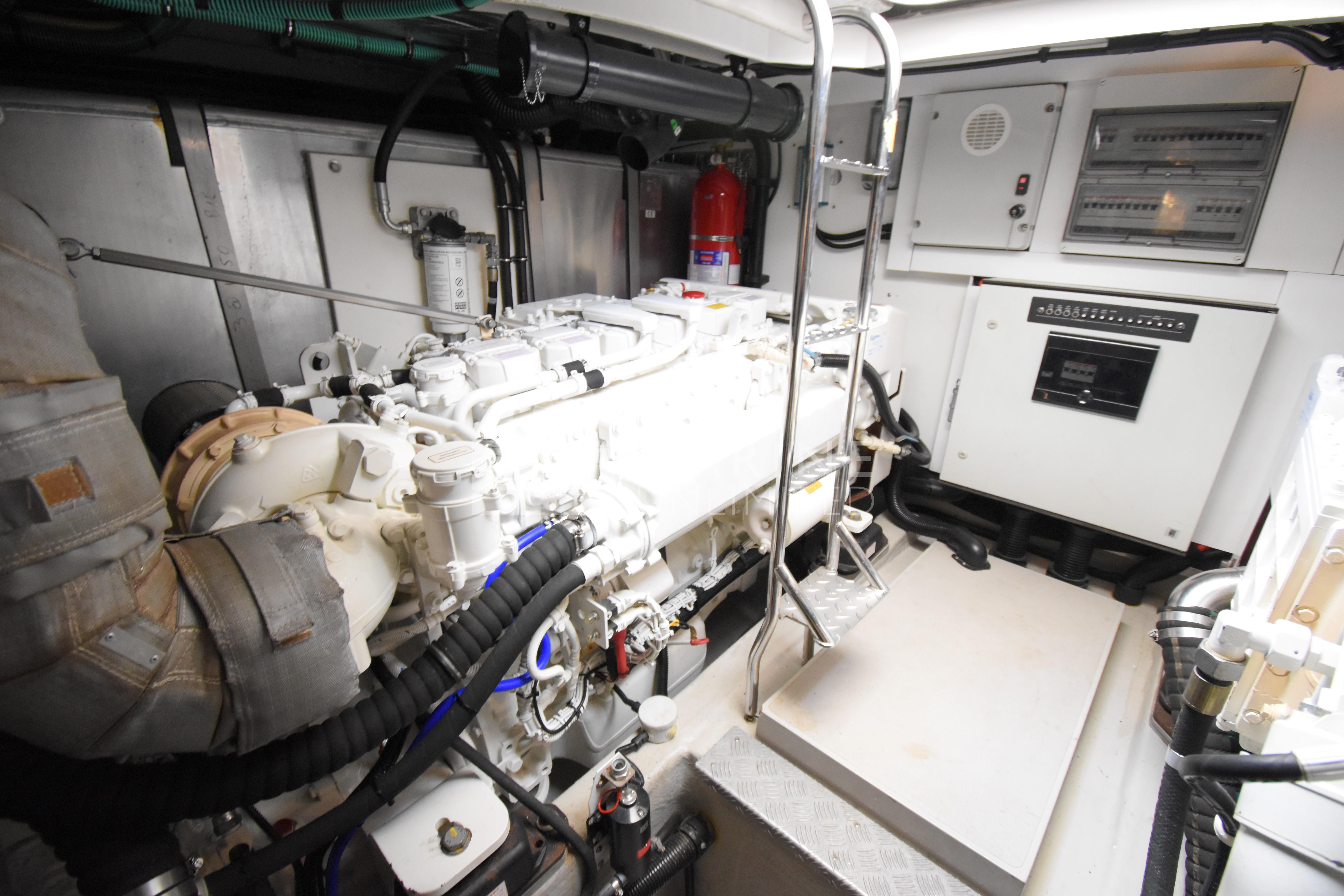 Engine room of 2010 Sunseeker Manhattan 52 yacht, featuring mechanical equipment and control panels.