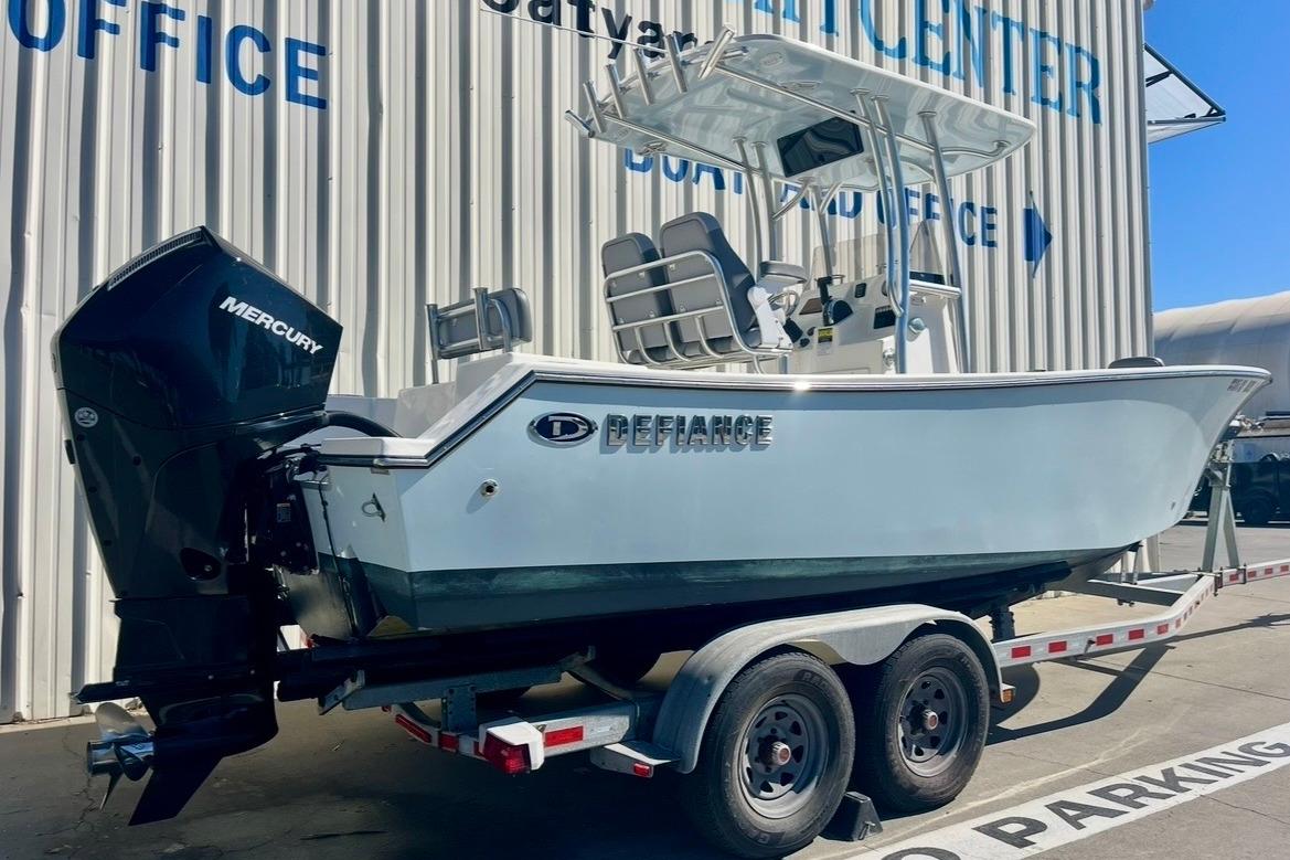 2025 Defiance Catalina 240 boat on trailer, featuring Mercury outboard motor.