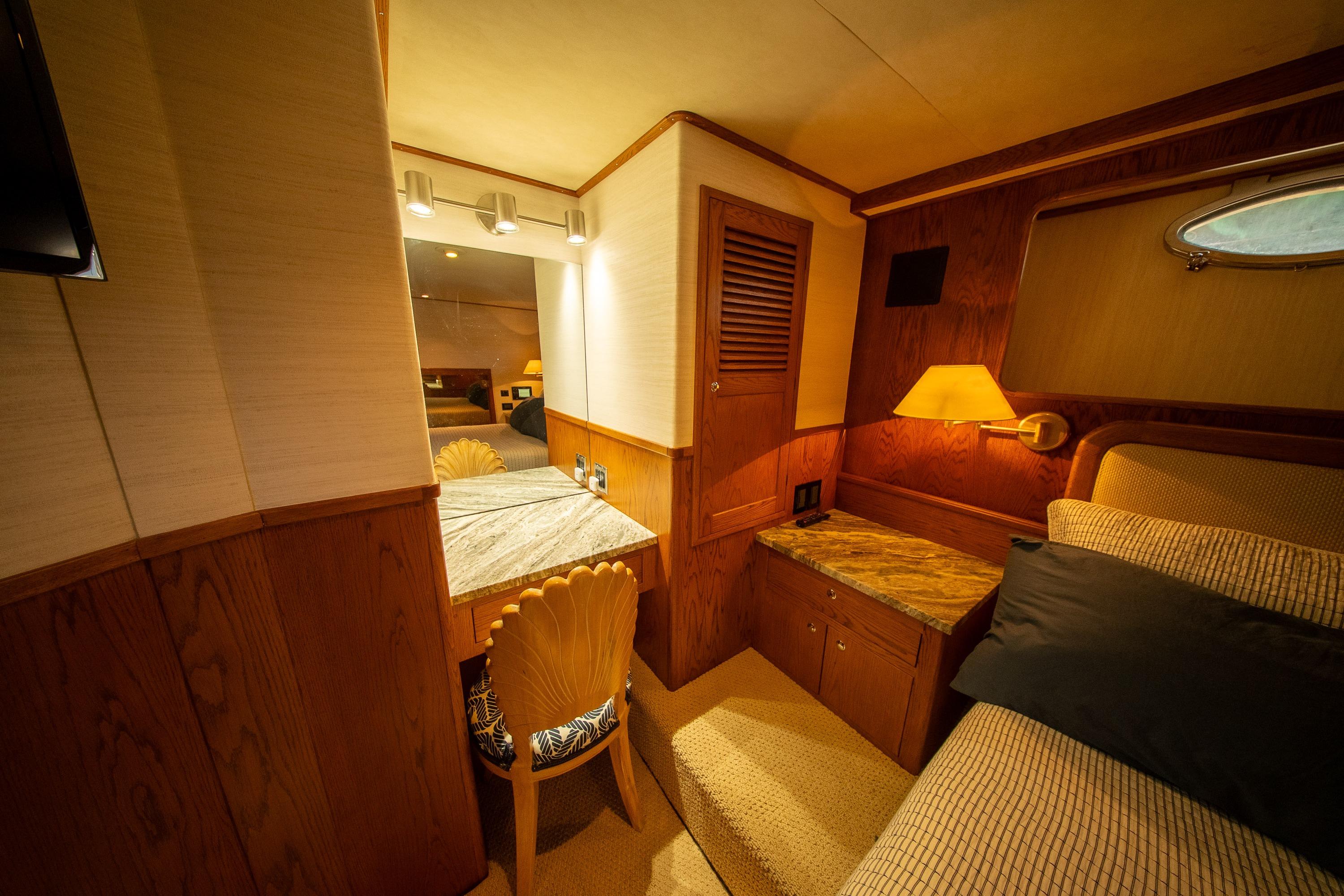 Luxurious interior of 1988 Philbrooks Bill Garden Pilot House Motor Yacht cabin.