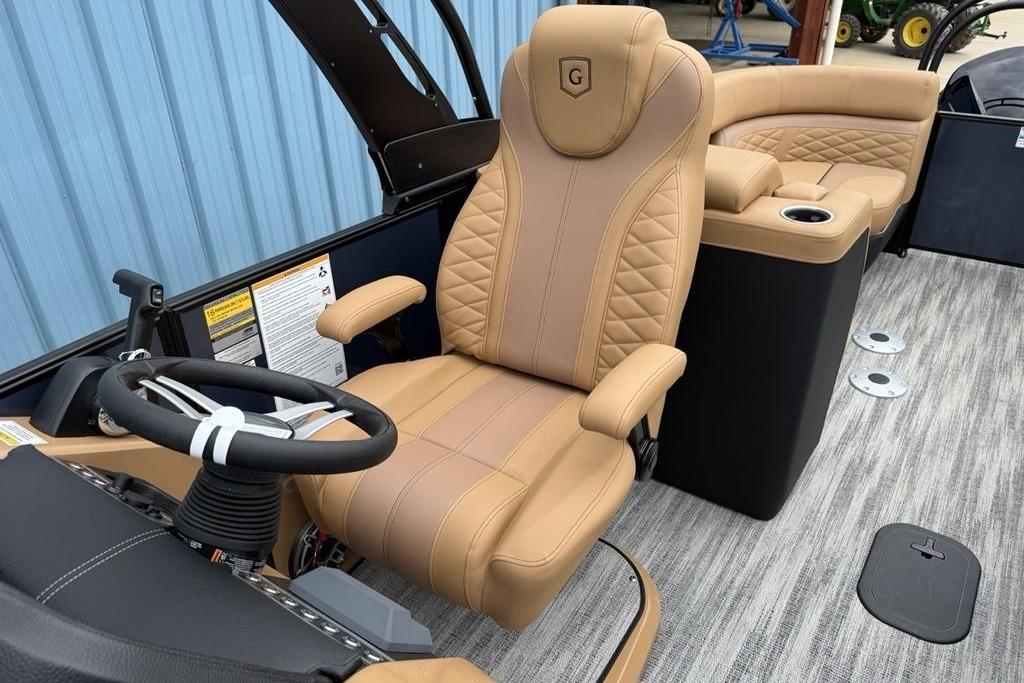 Luxurious interior of 2026 Godfrey Monaco 235 SFLC iMPACT pontoon boat with tan seating.