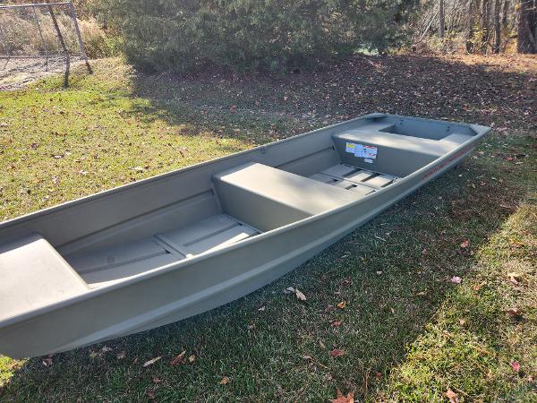 2025 Tracker Grizzly 1436 Utility boat on grass, sunny day.