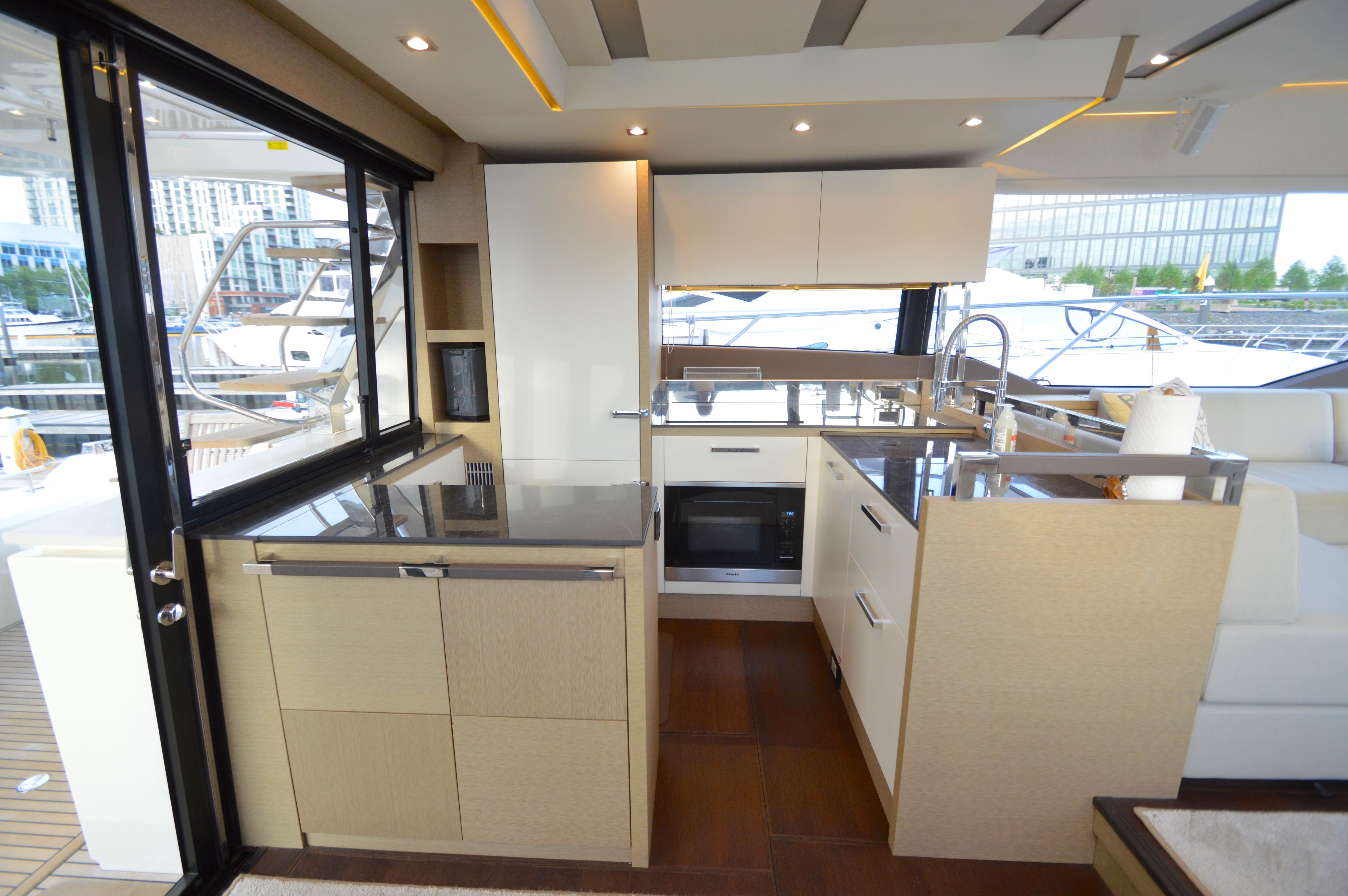 Modern kitchen on a 2017 Prestige 630 yacht.