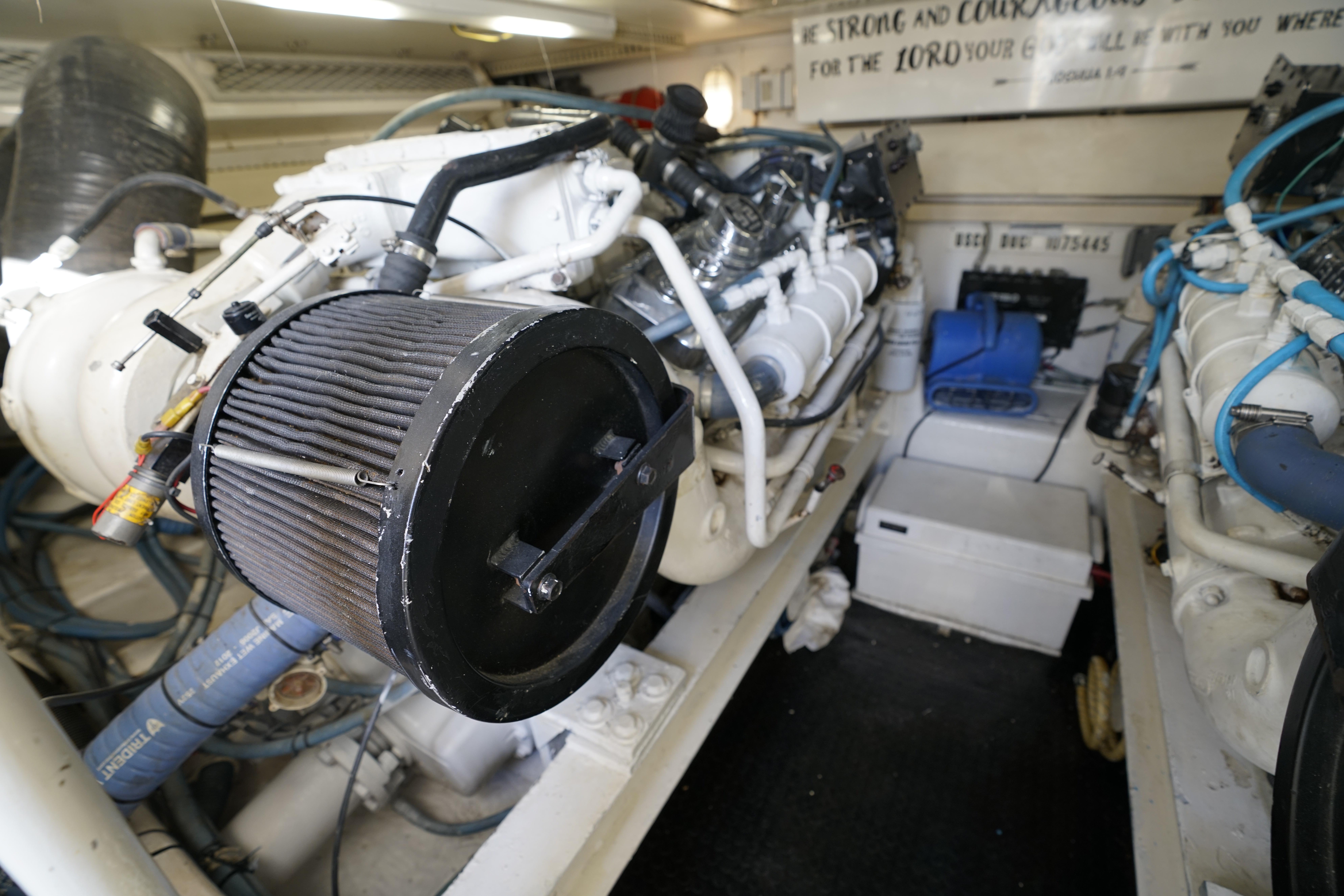 Engine room of 1998 Viking Open Express 43 with visible components and wiring.