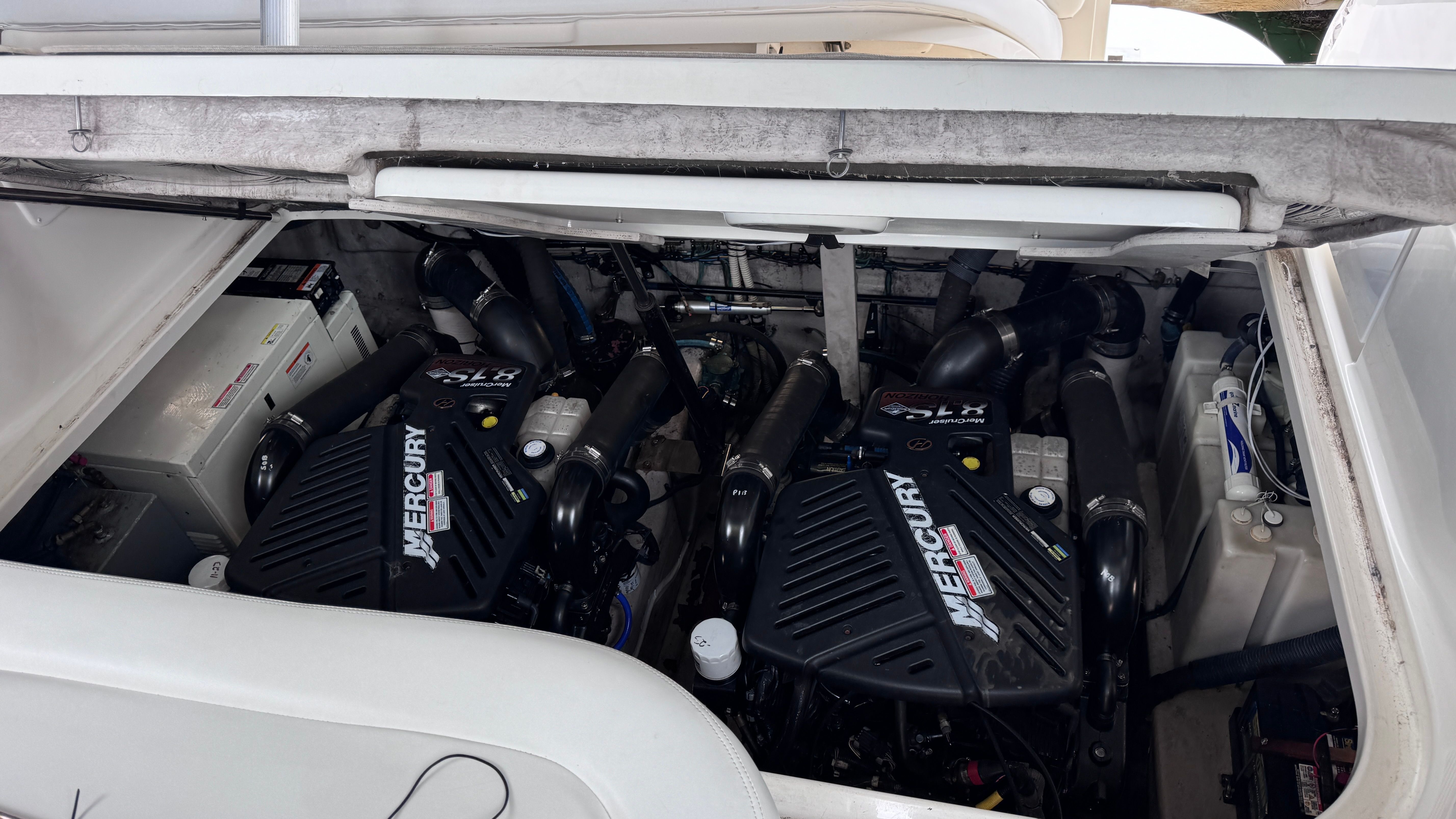 Engine compartment of a 2003 Sea Ray 360 Sundancer with twin Mercury engines.