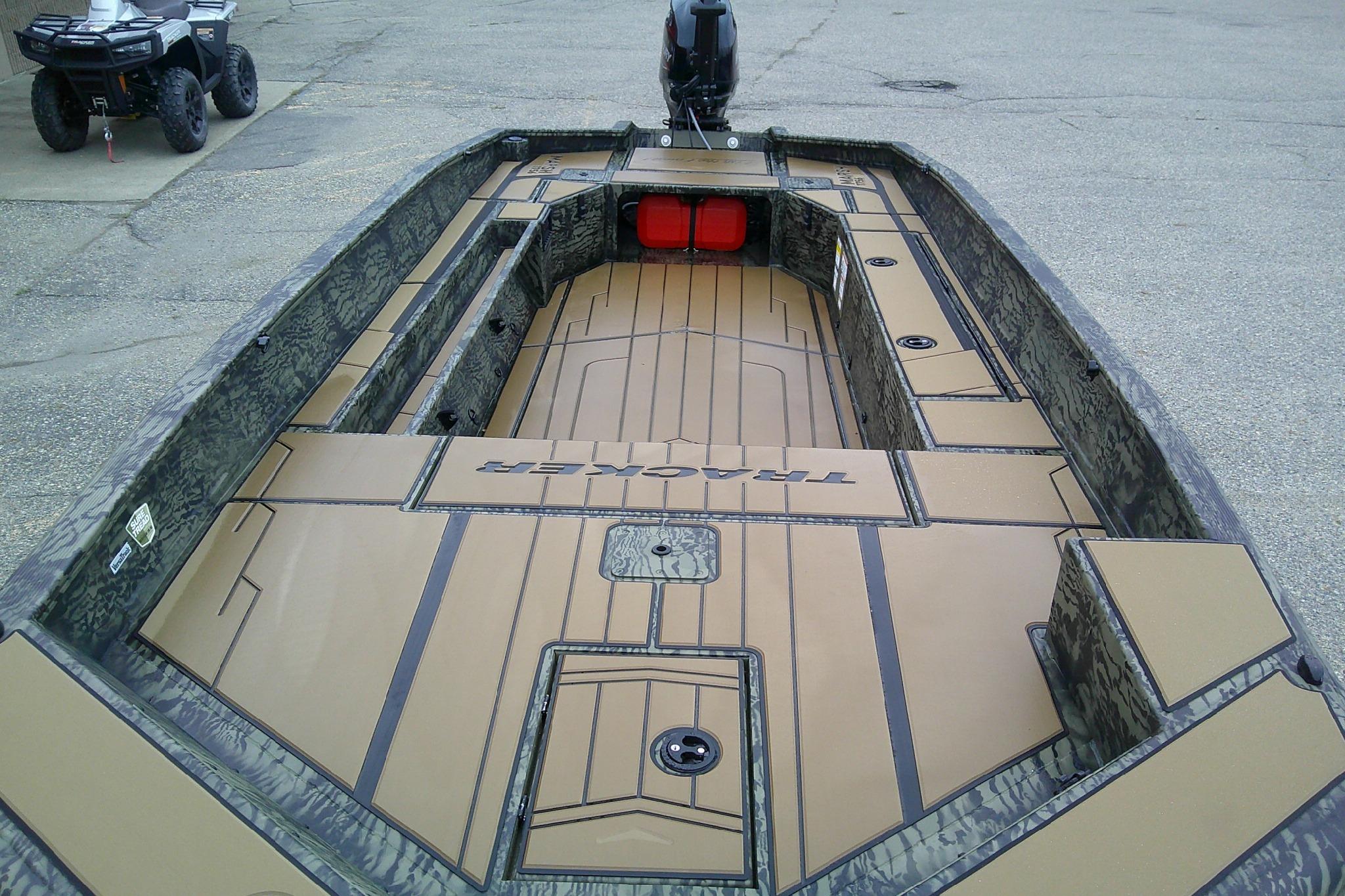 2026 Tracker Grizzly 1756 T Marsh boat with camo design and spacious deck layout.