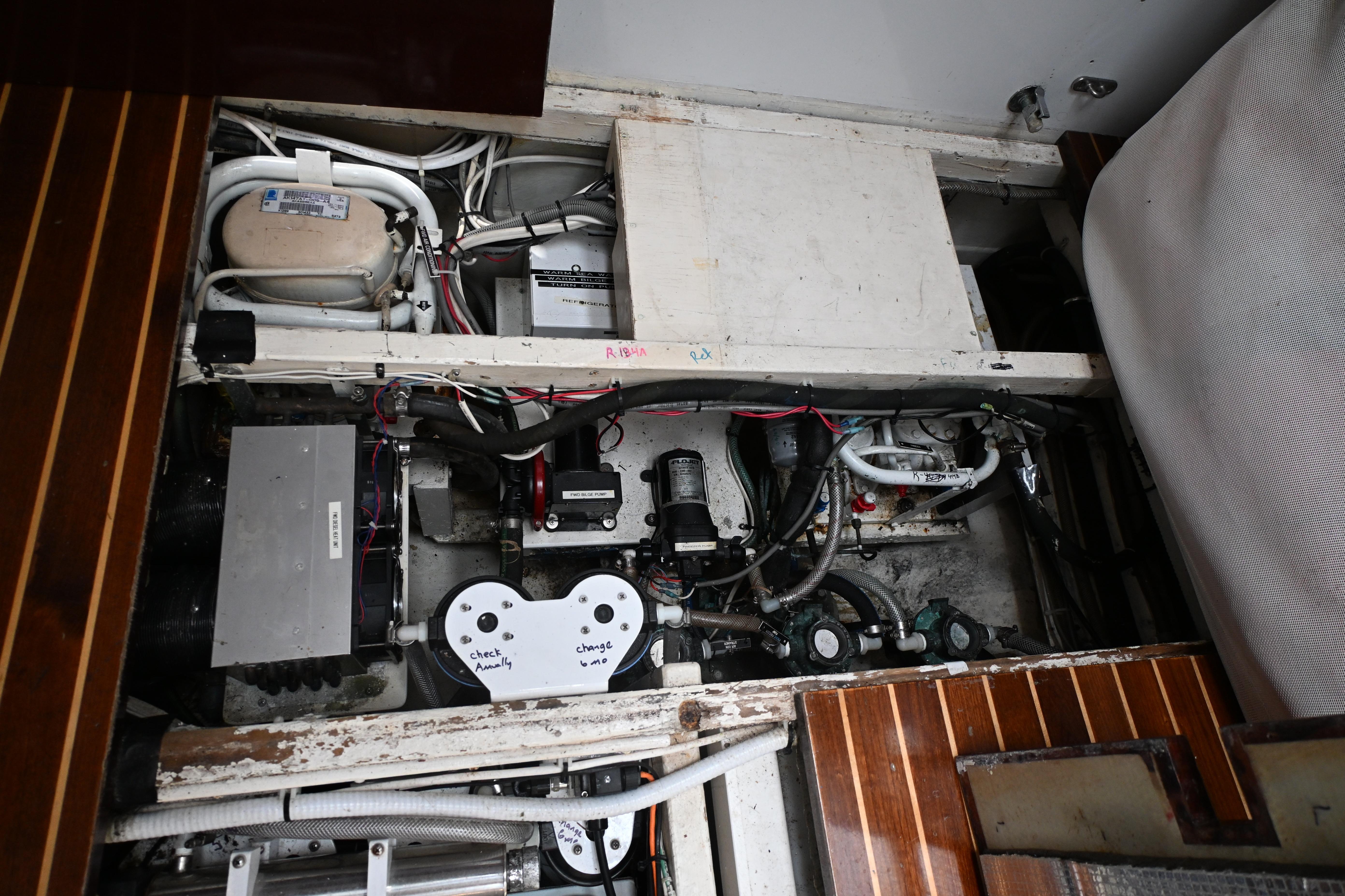 Engine compartment of a 1968 Abeking & Rasmussen Tripp 74 yacht, showcasing mechanical components.