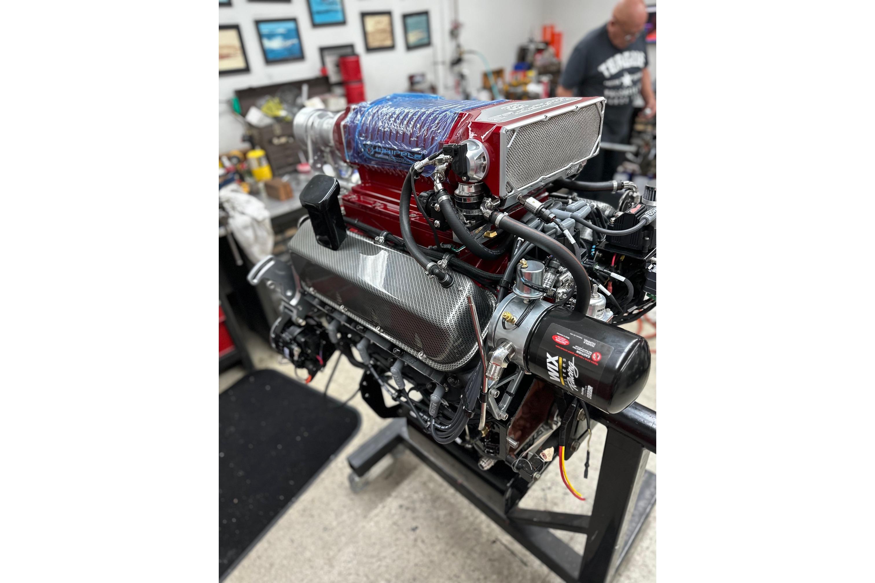 High-performance engine of a 2013 Nordic 39 POKER RUN boat in a workshop setting.