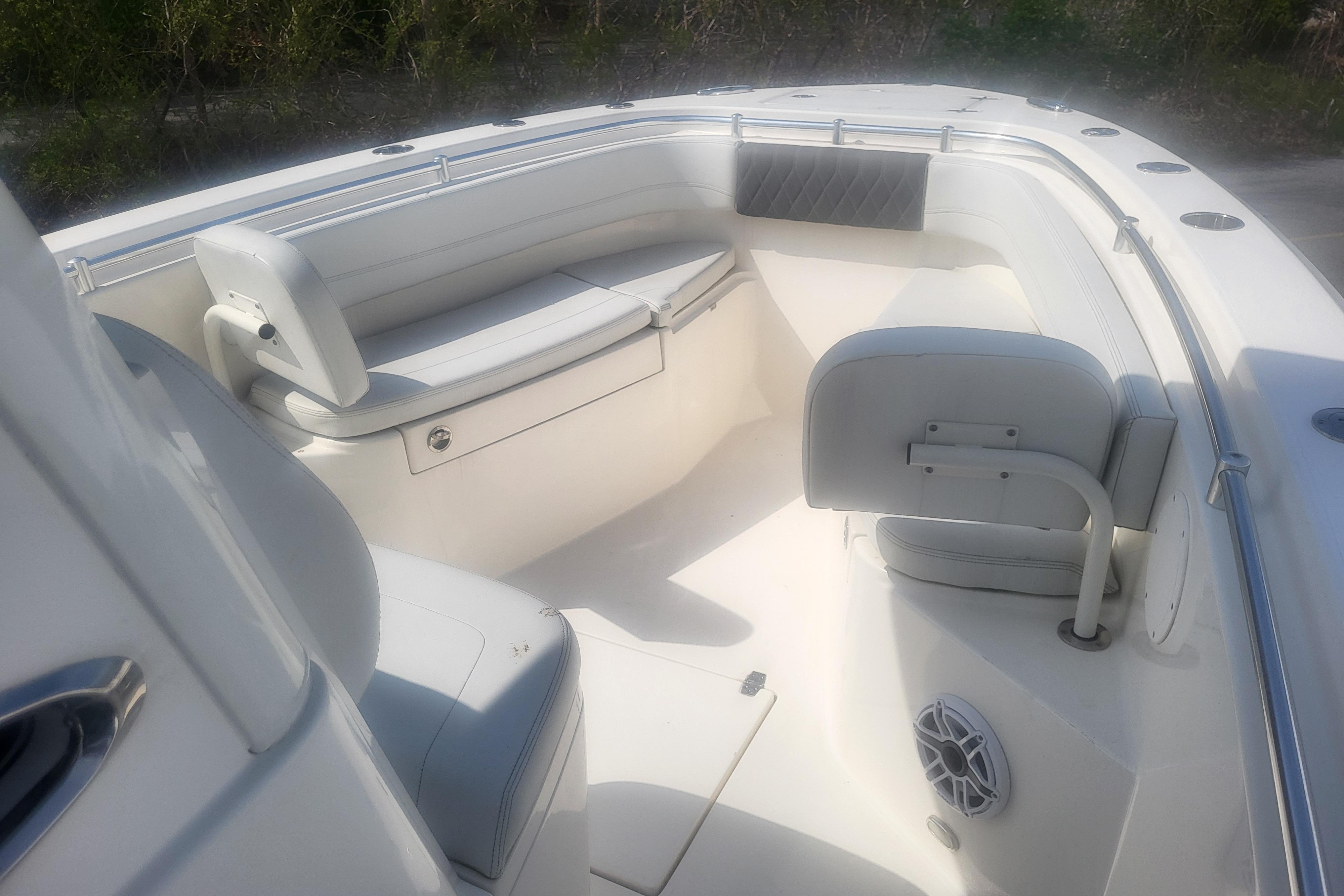 2022 Cobia 262 Center Console boat interior with cushioned seating and speaker.