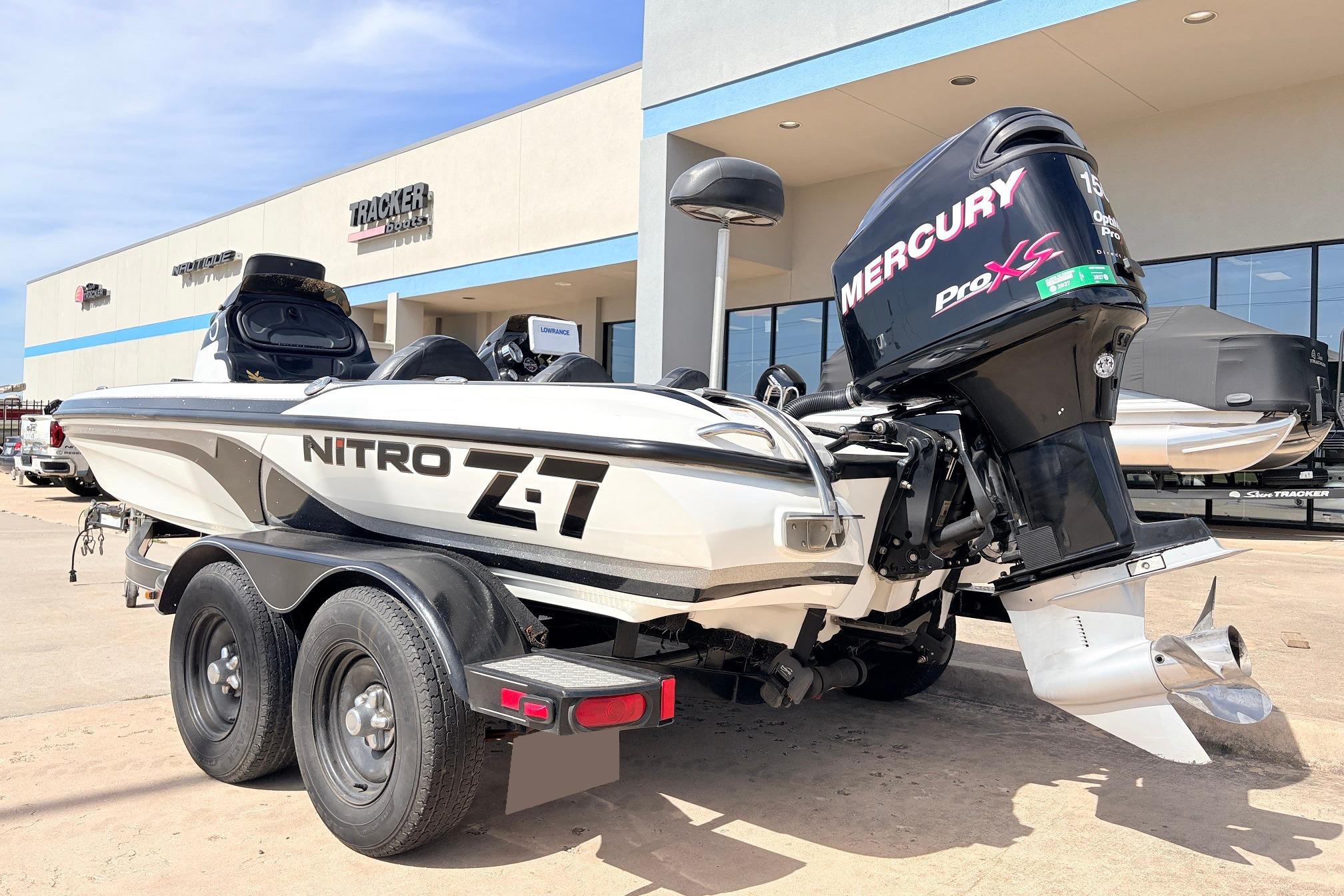 2011 Nitro Z-7 boat with Mercury Pro XS engine, parked outside Tracker Boats dealership.