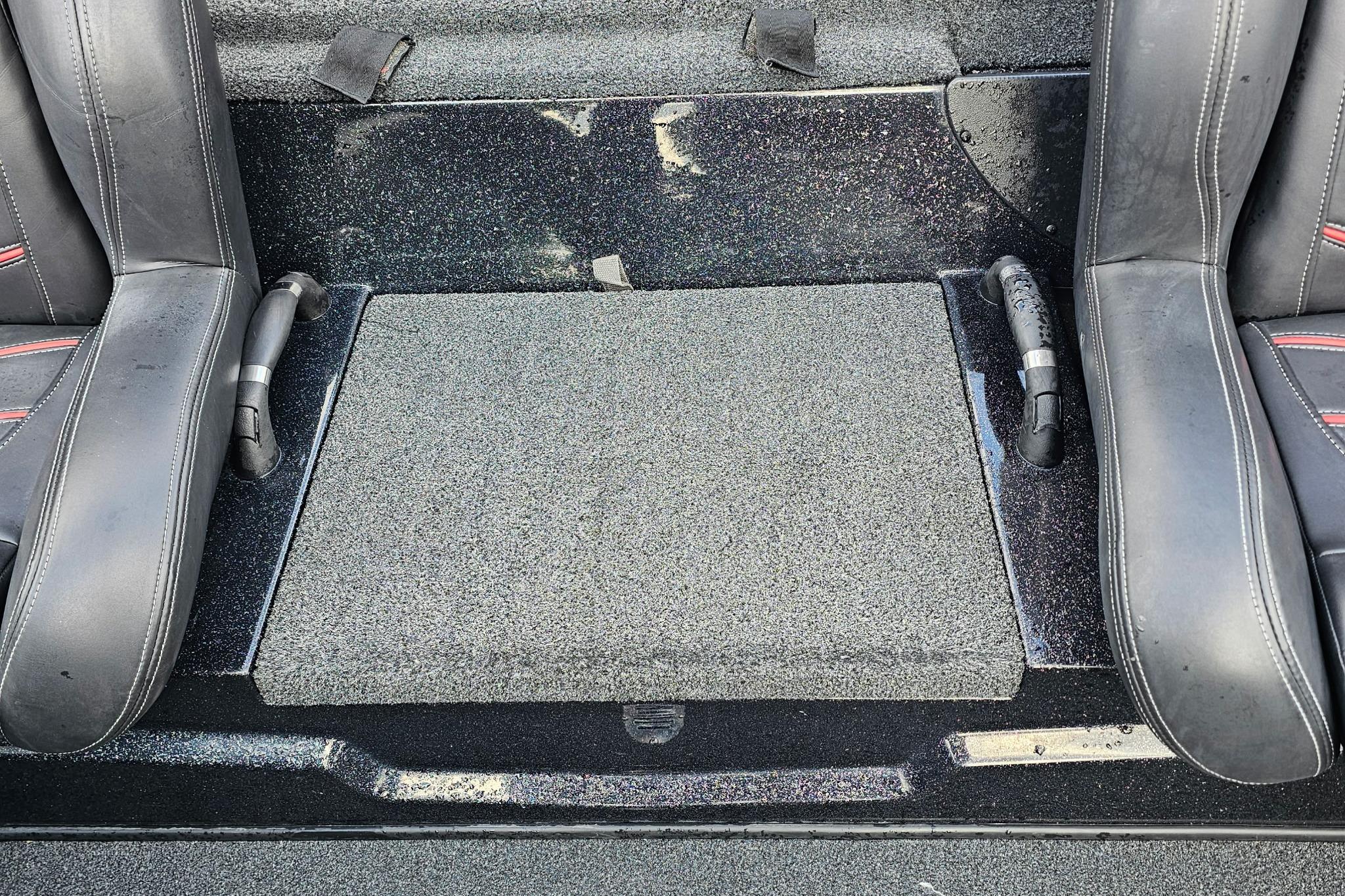Interior of a 2017 Nitro Z20 Pro boat with black leather seats and textured flooring.