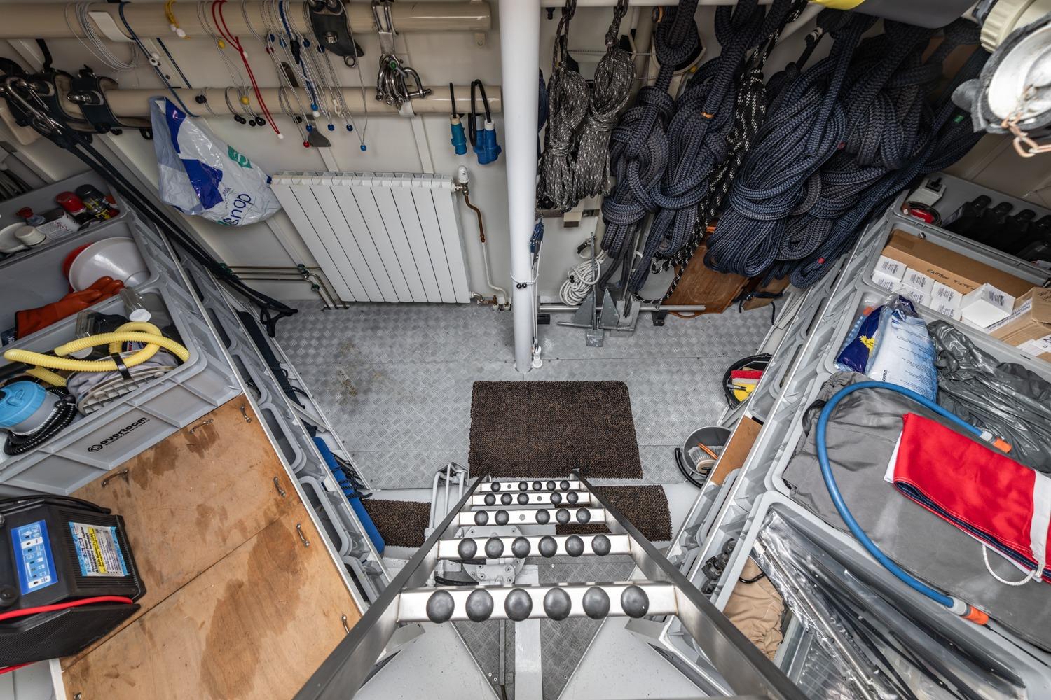 Interior of 1999 Vitters Trawler 19.90 Explorer, showcasing organized storage and nautical equipment.