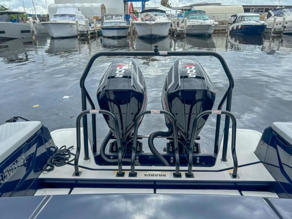 2024 BRABUS Shadow 1000 ST boat with twin outboard engines docked at marina.