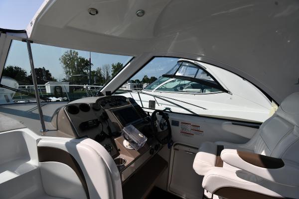 2010 Cruisers Yachts 390 Sports Coupe cockpit with modern controls and seating.
