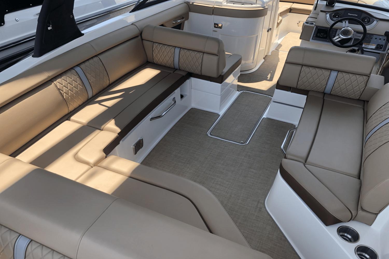 2017 Sea Ray SDX 270 boat interior with luxurious tan seating and modern design.