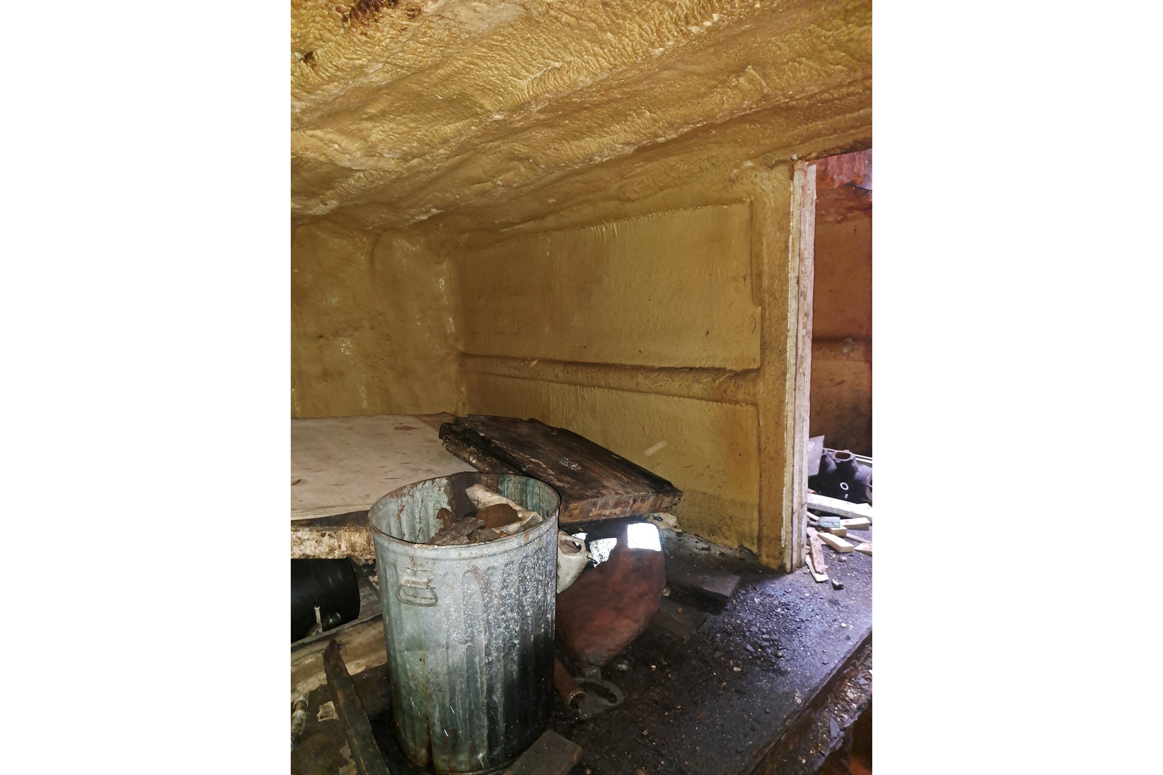 Interior of a 1979 Custom Steel Trawler Dragger, showing storage area with metal bin.