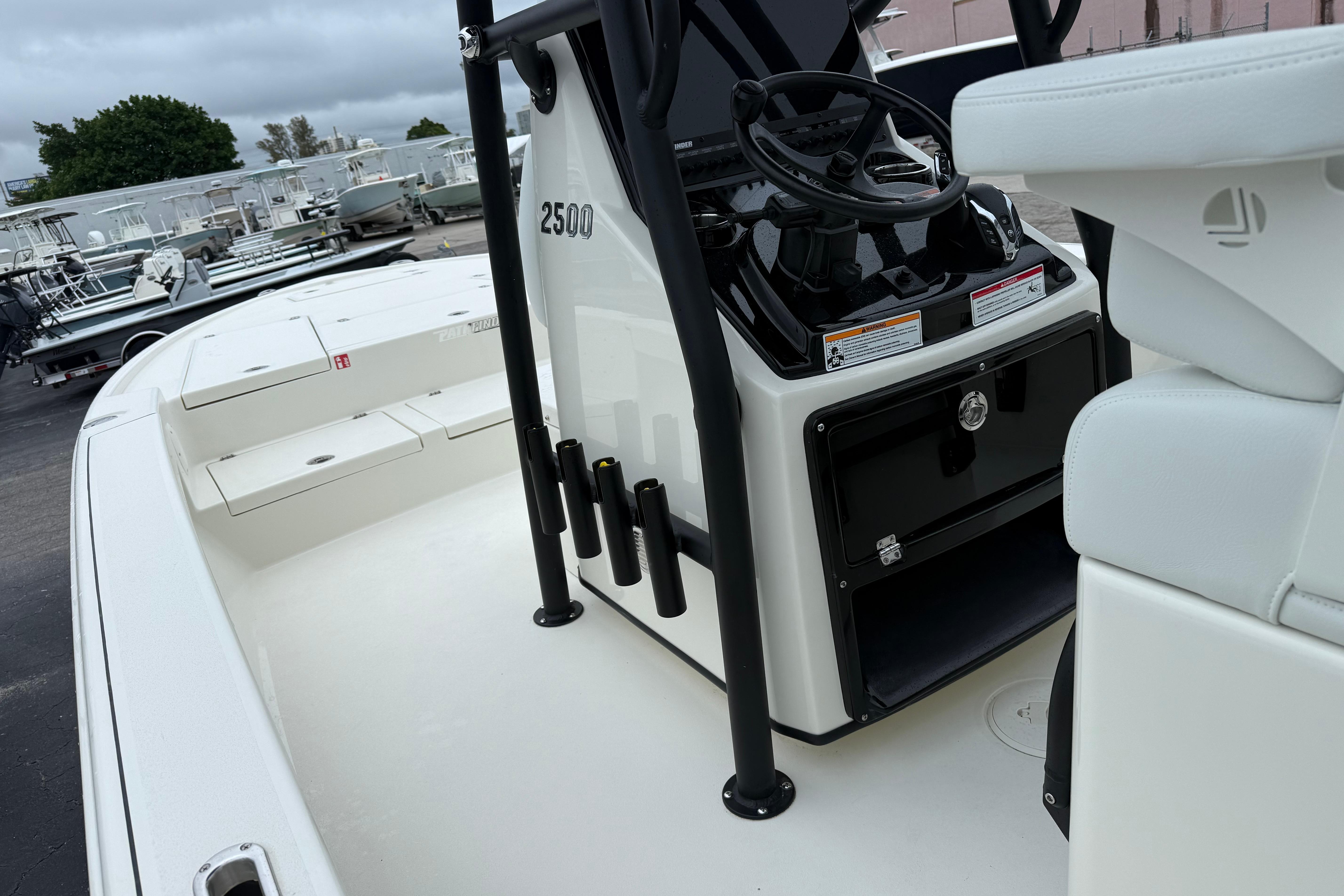 2026 Pathfinder 2500 Hybrid boat interior with steering console and seating.