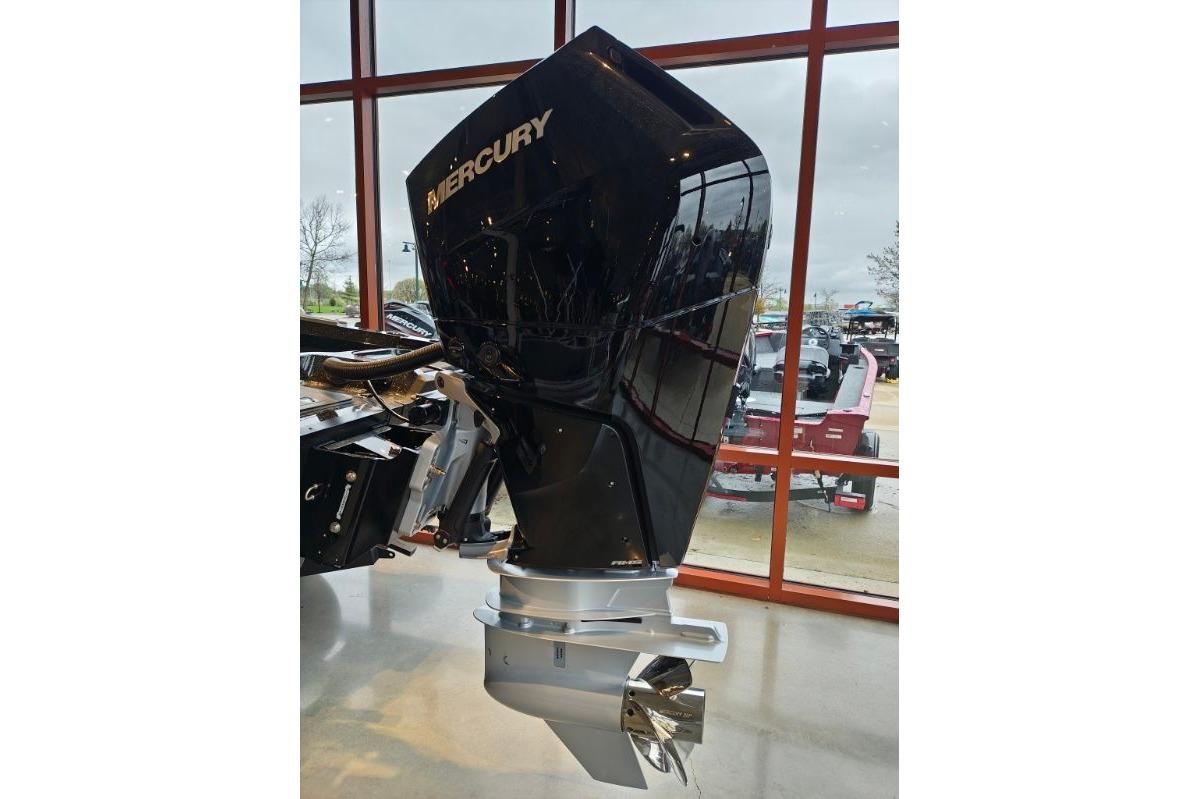 2026 Nitro ZV21 boat with Mercury outboard motor displayed indoors.