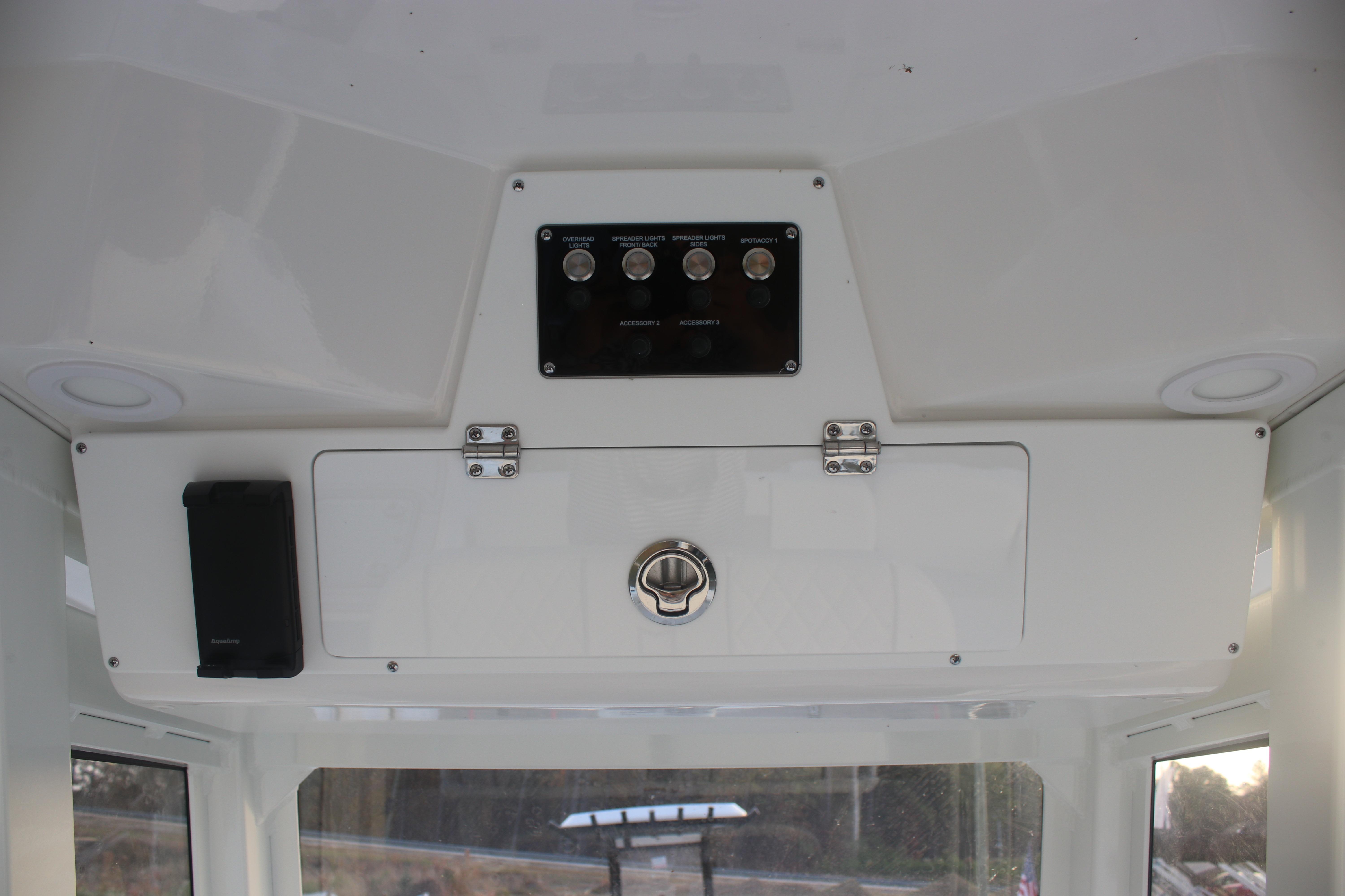 2026 Sea Fox 228 Commander interior dashboard with control panel and storage compartment.