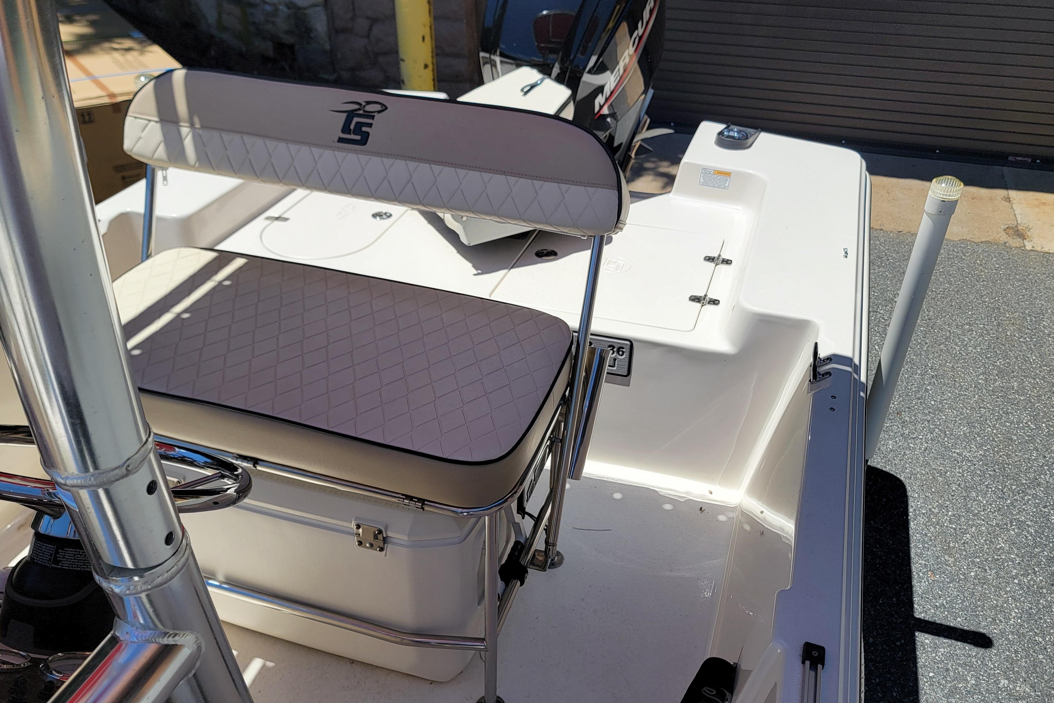 2021 Carolina Skiff 178 JLS boat interior with cushioned seating and storage.
