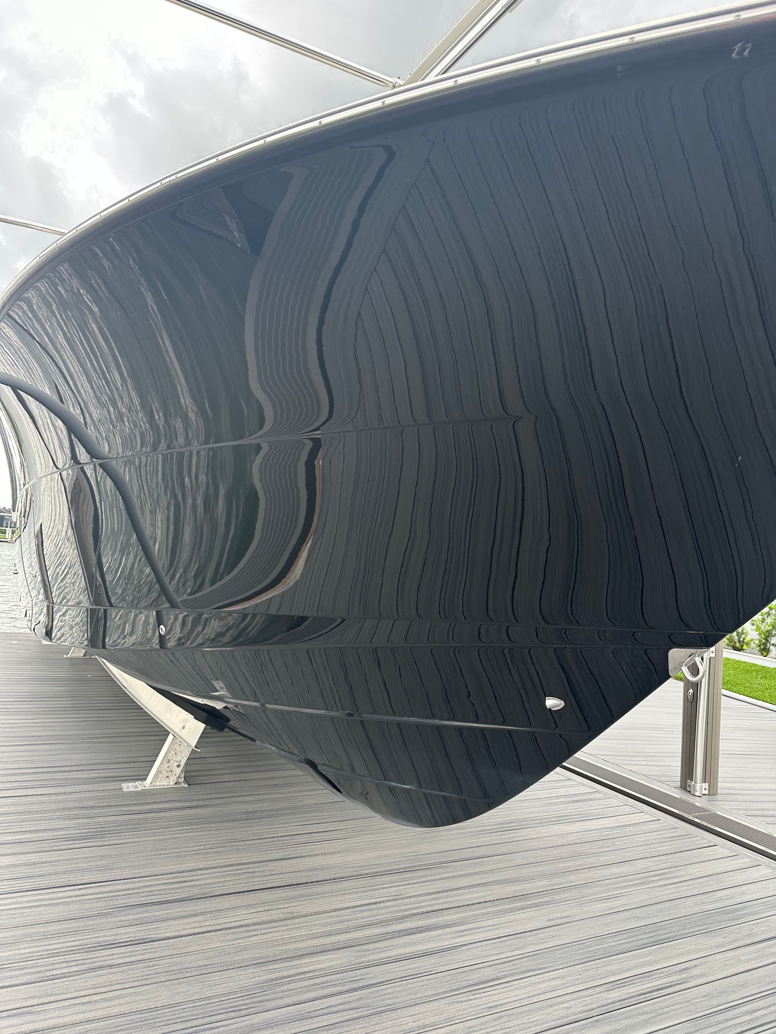 Scout 425 LXF 2022 boat hull on a dock.