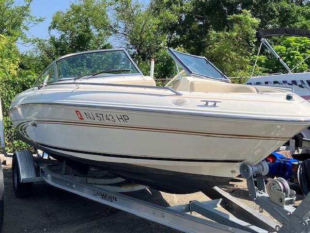 1997 Sea Ray 190 Bow Rider on trailer, side view.