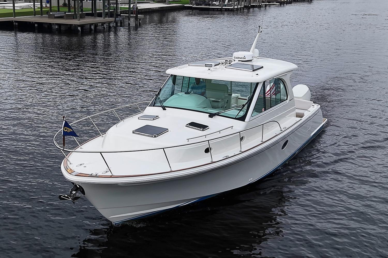 2023 Hinckley Sport Boat 40 X cruising on calm waters.