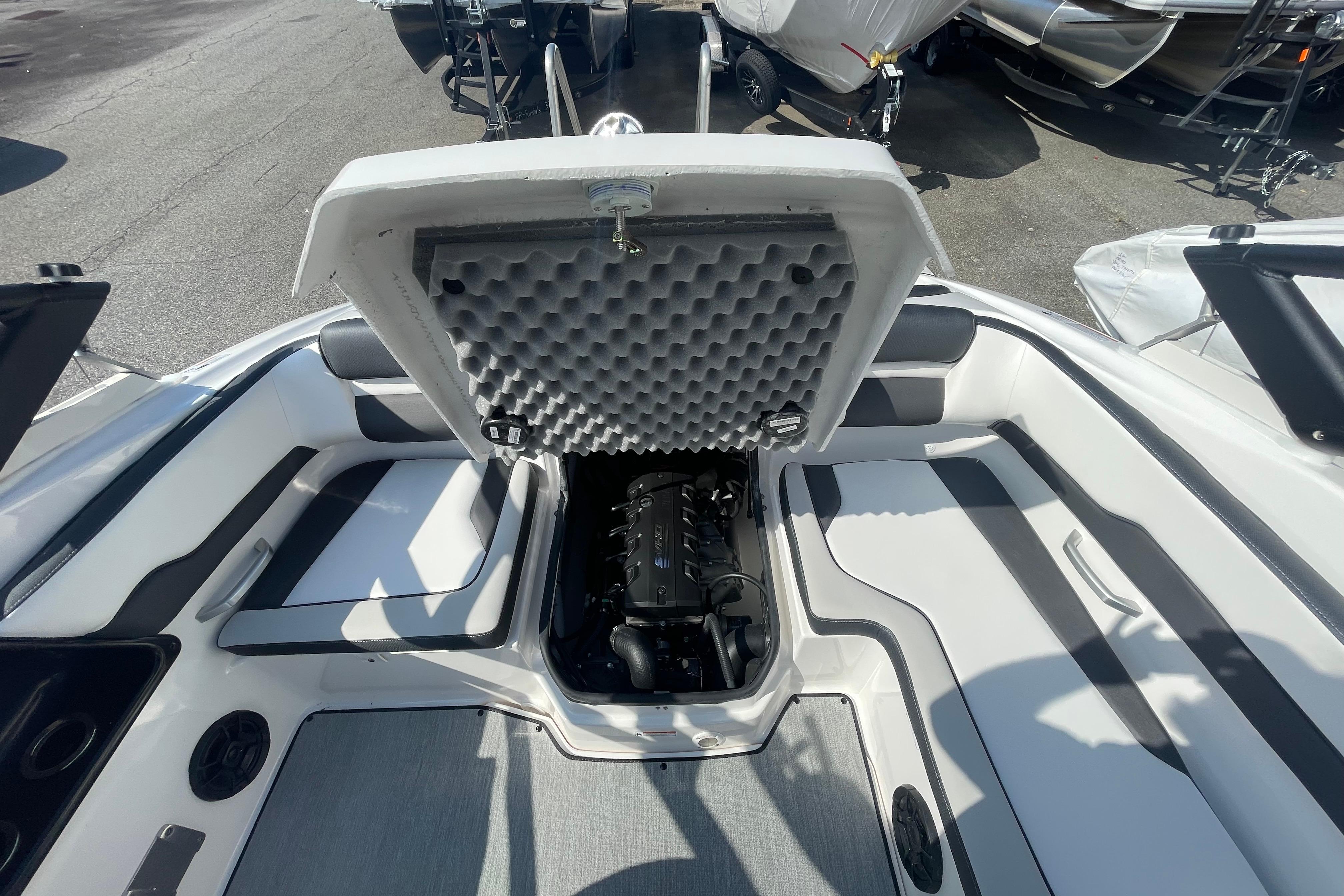 2026 Yamaha Boats AR195 engine compartment with open hatch, showcasing interior design.