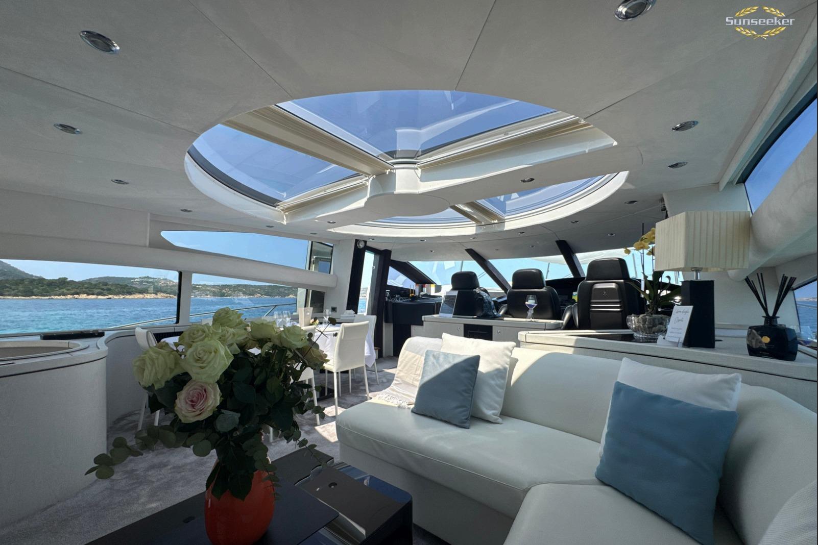 Luxurious interior of 2007 Sunseeker Predator 82 yacht with panoramic windows and elegant decor.