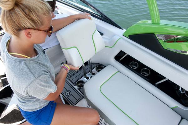 Manufacturer Provided Image: Woman adjusting seat on 2013 Nautique Super Air Nautique 230 boat.