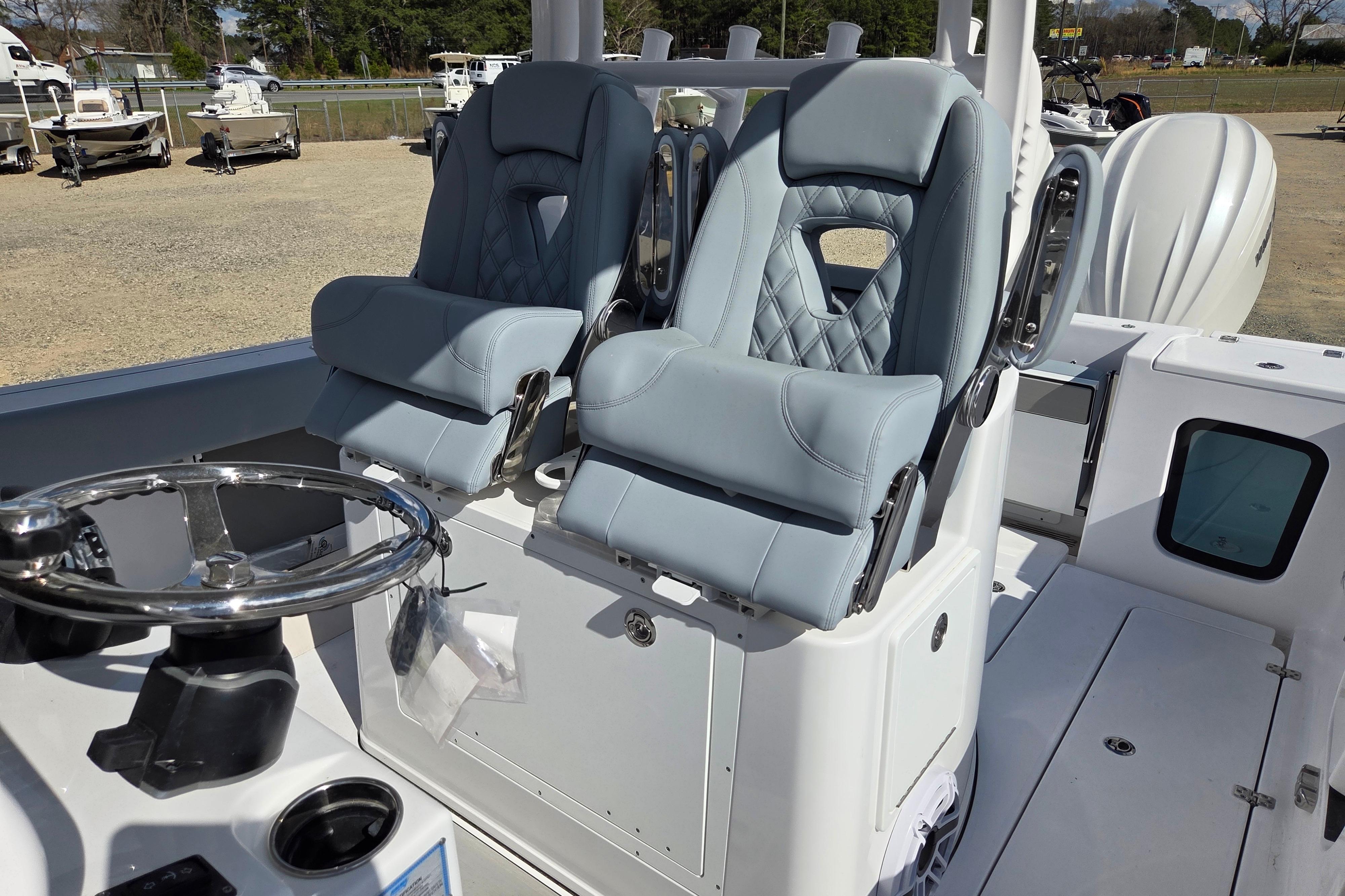 2026 Sportsman Open 282 Center Console with dual cushioned seats and steering wheel.