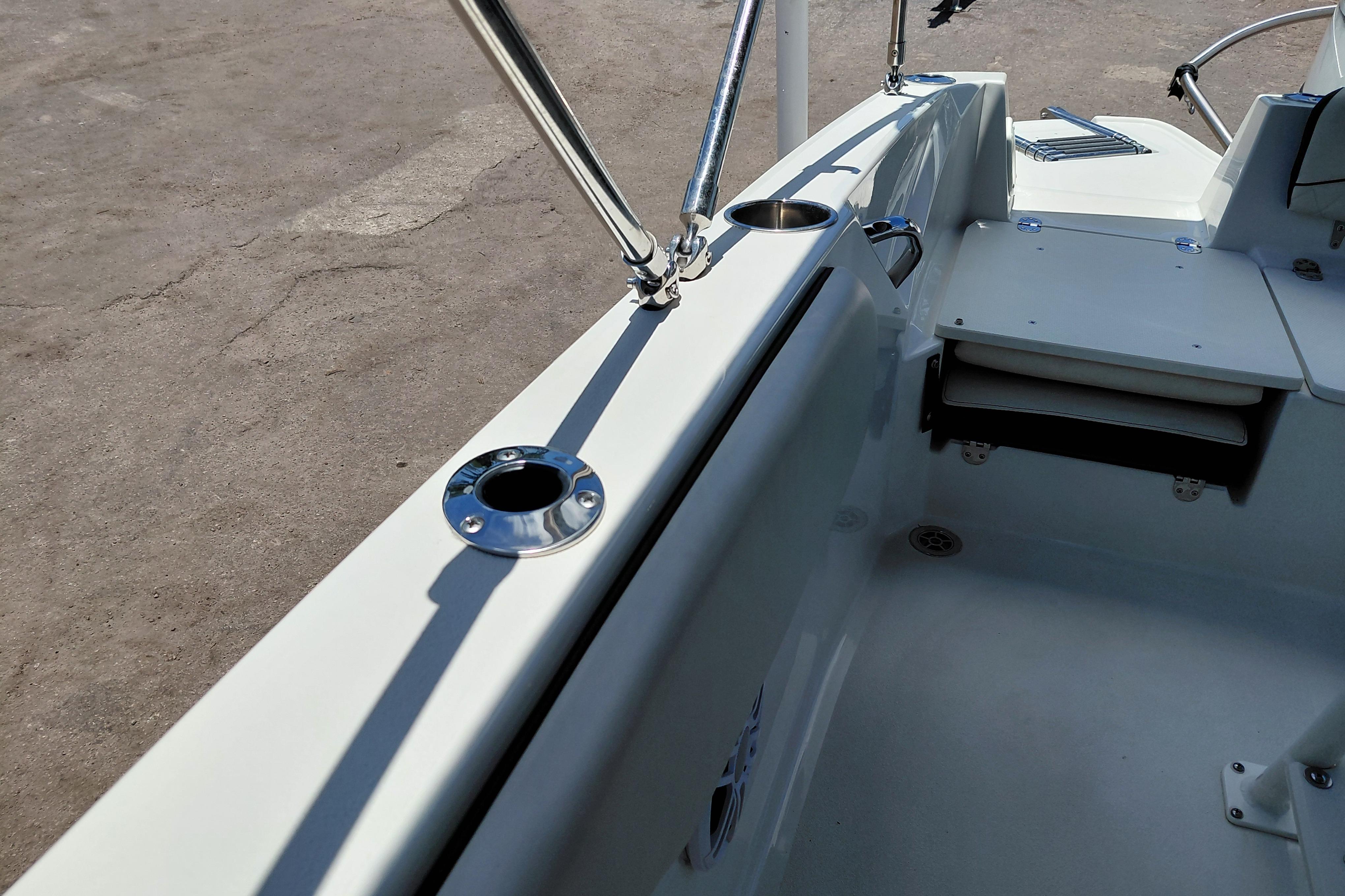 2023 Stingray 206 CC boat interior with stainless steel fittings and seating area.