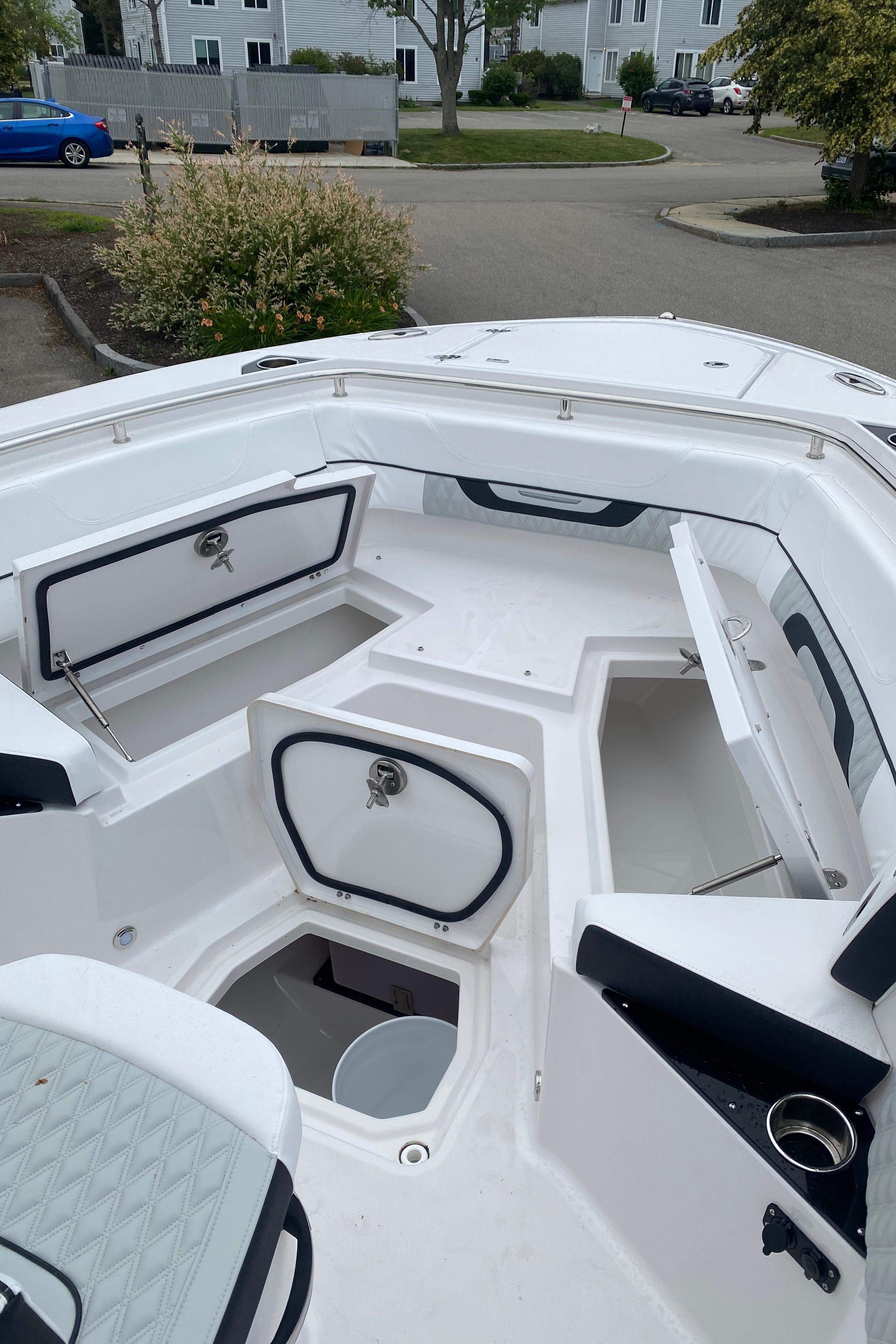 2025 Blackfin 252 CC boat interior with open storage compartments and seating.