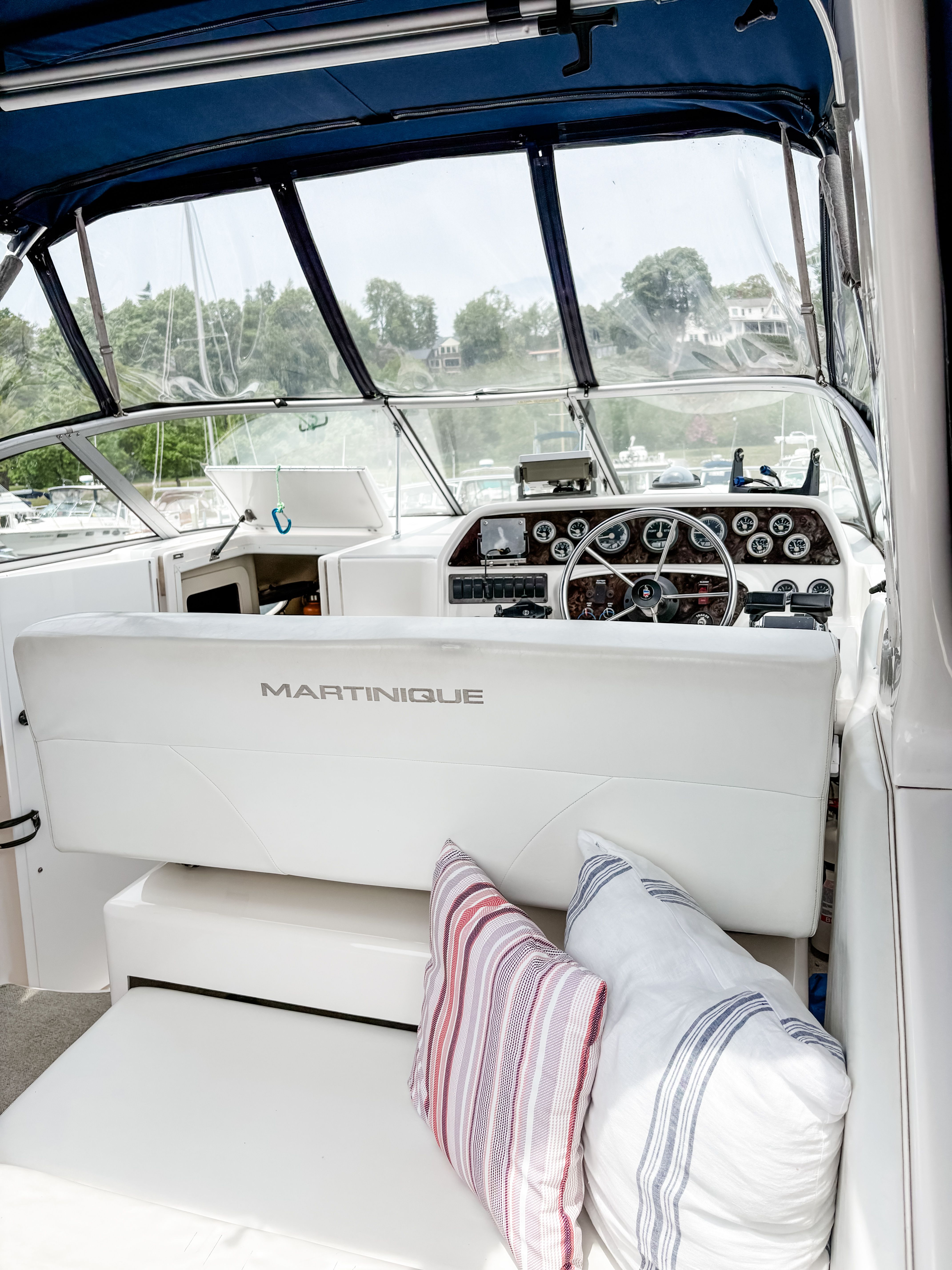Interior of a 1997 Wellcraft Martinique boat with cushions.
