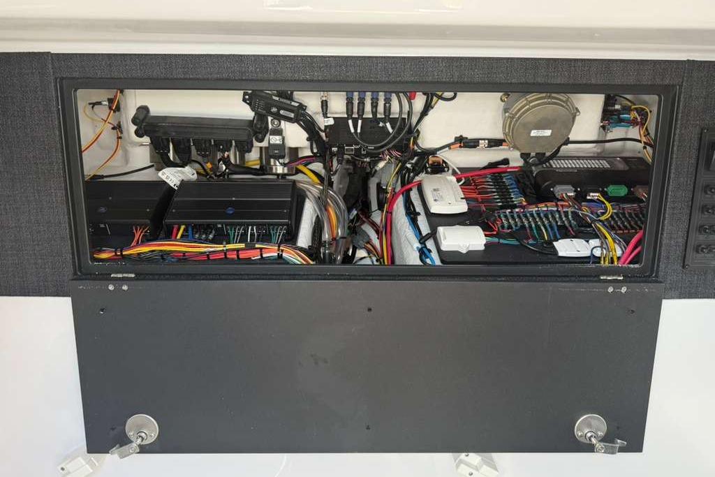 Electrical panel of 2026 Monterey Elite 30 OB boat, showcasing wiring and components.