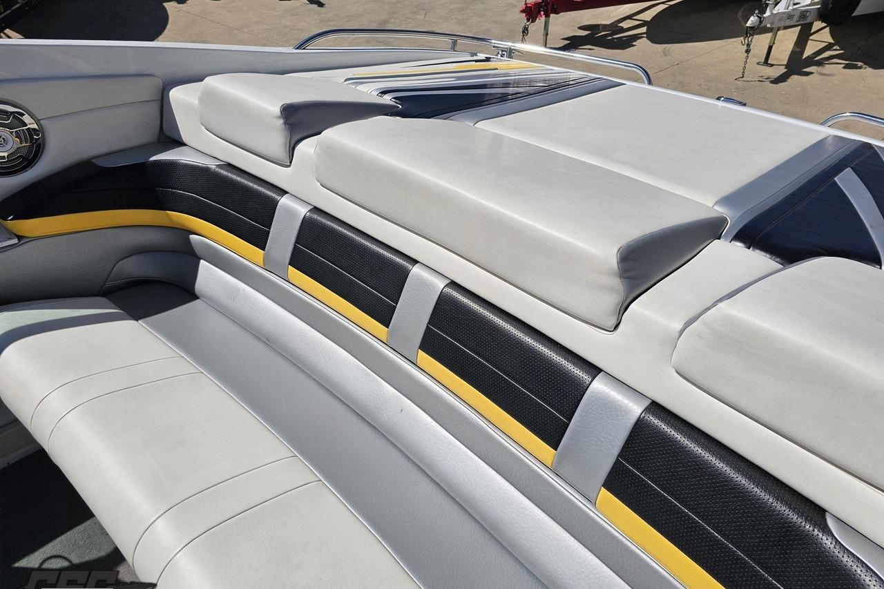 2014 Formula 292 FASTech boat interior with sleek white and black seating, yellow accents.