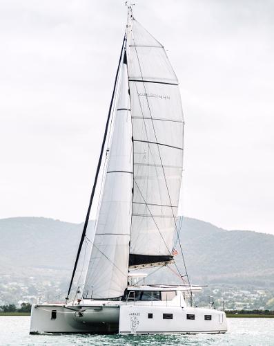 Modern Vision 444 catamaran sailing on calm waters, 2026 model.
